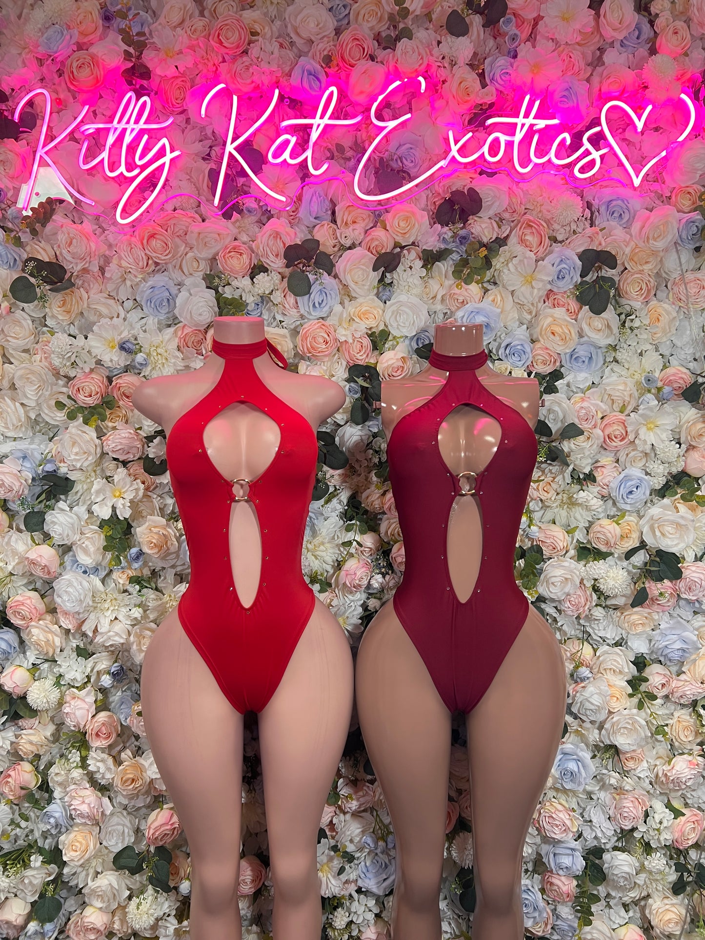 Red and maroon halter bodysuits with open back and oval cutout, cheeky leg