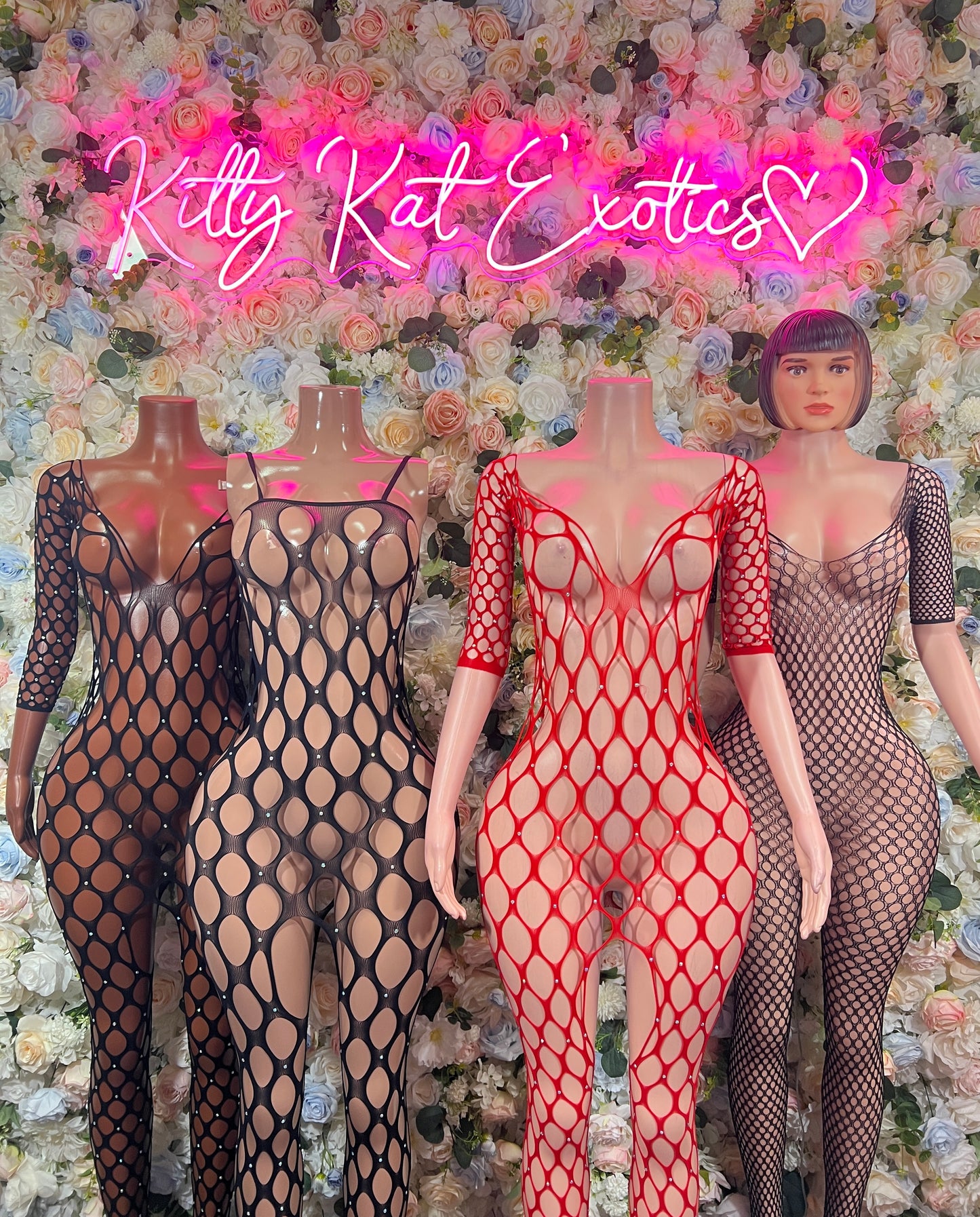 Black fishnet bodysuit with long sleeves and V neckline