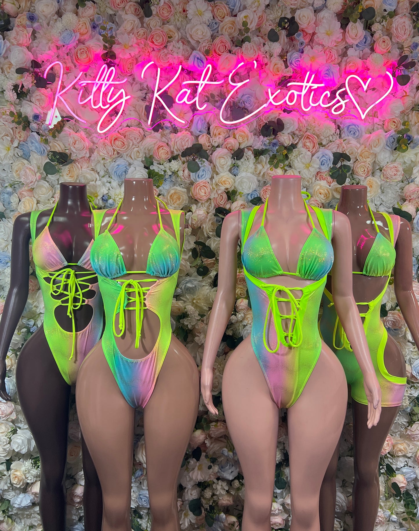 Holographic neon lace-up bodysuit with high-cut legs, shown on mannequin front view
