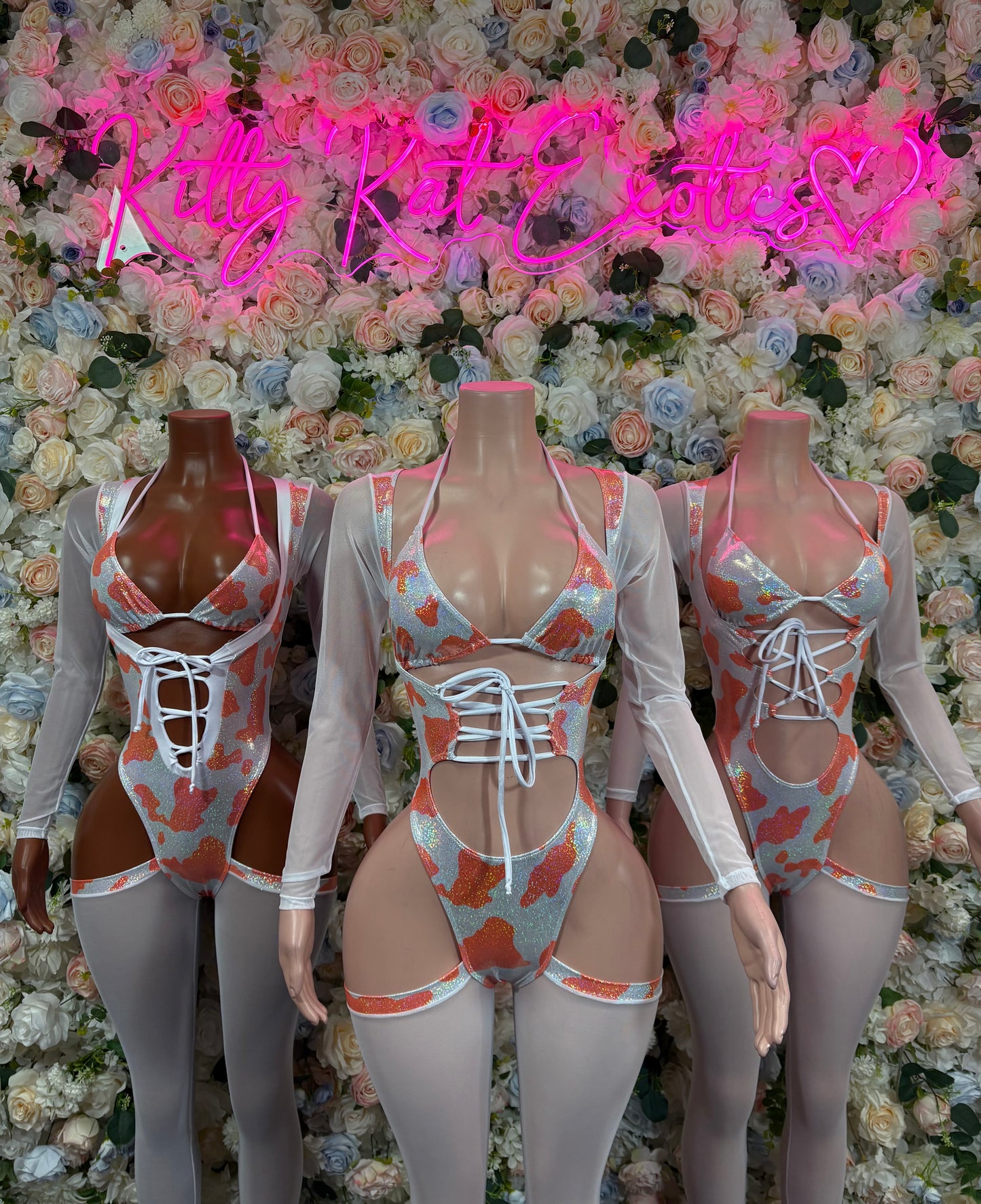 Orange cow print long-sleeve bodysuit with corset-style lace-up front and garter straps