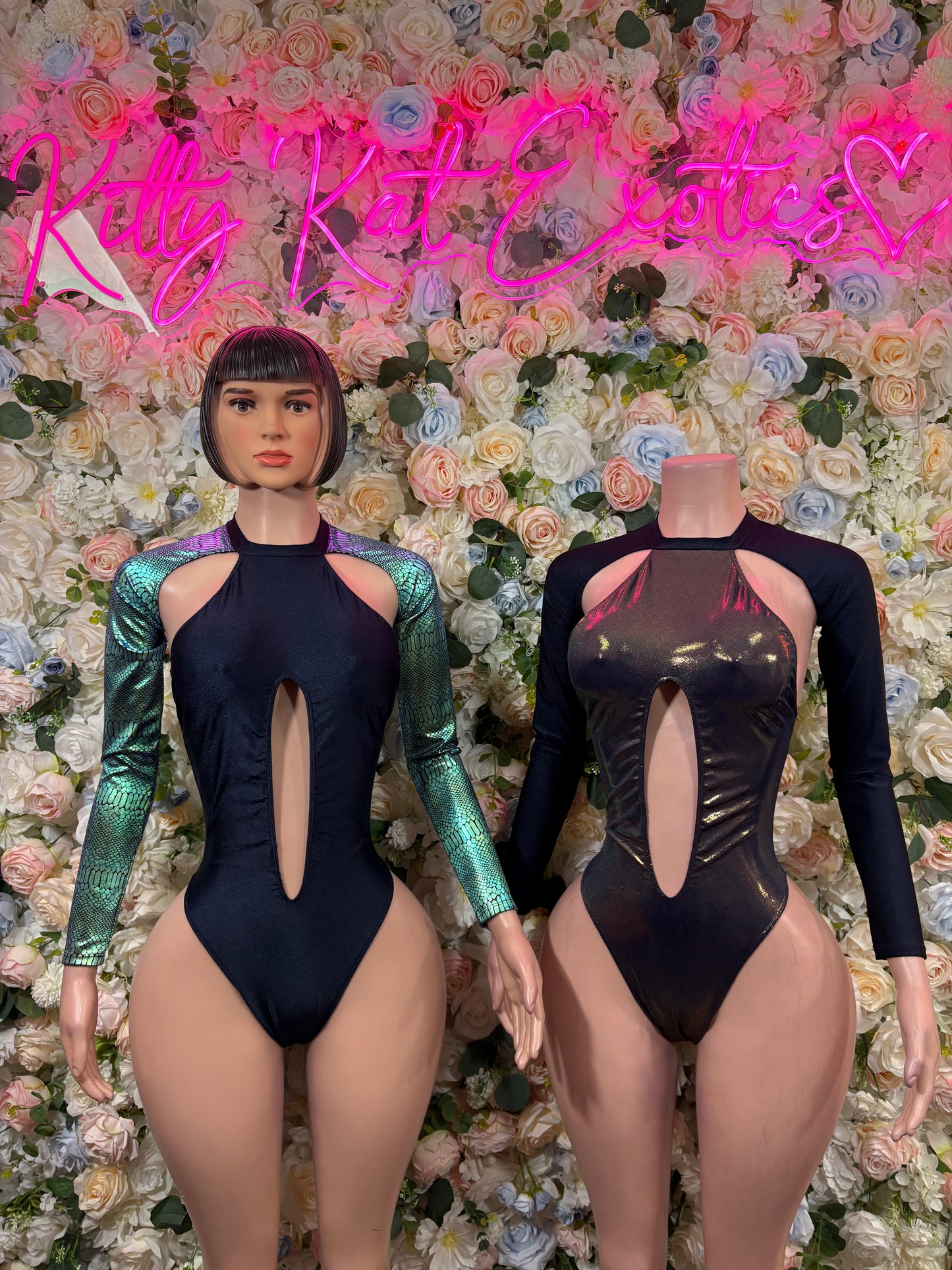 One-piece bodysuit with high leg, long sleeves, and chest keyhole; metallic front