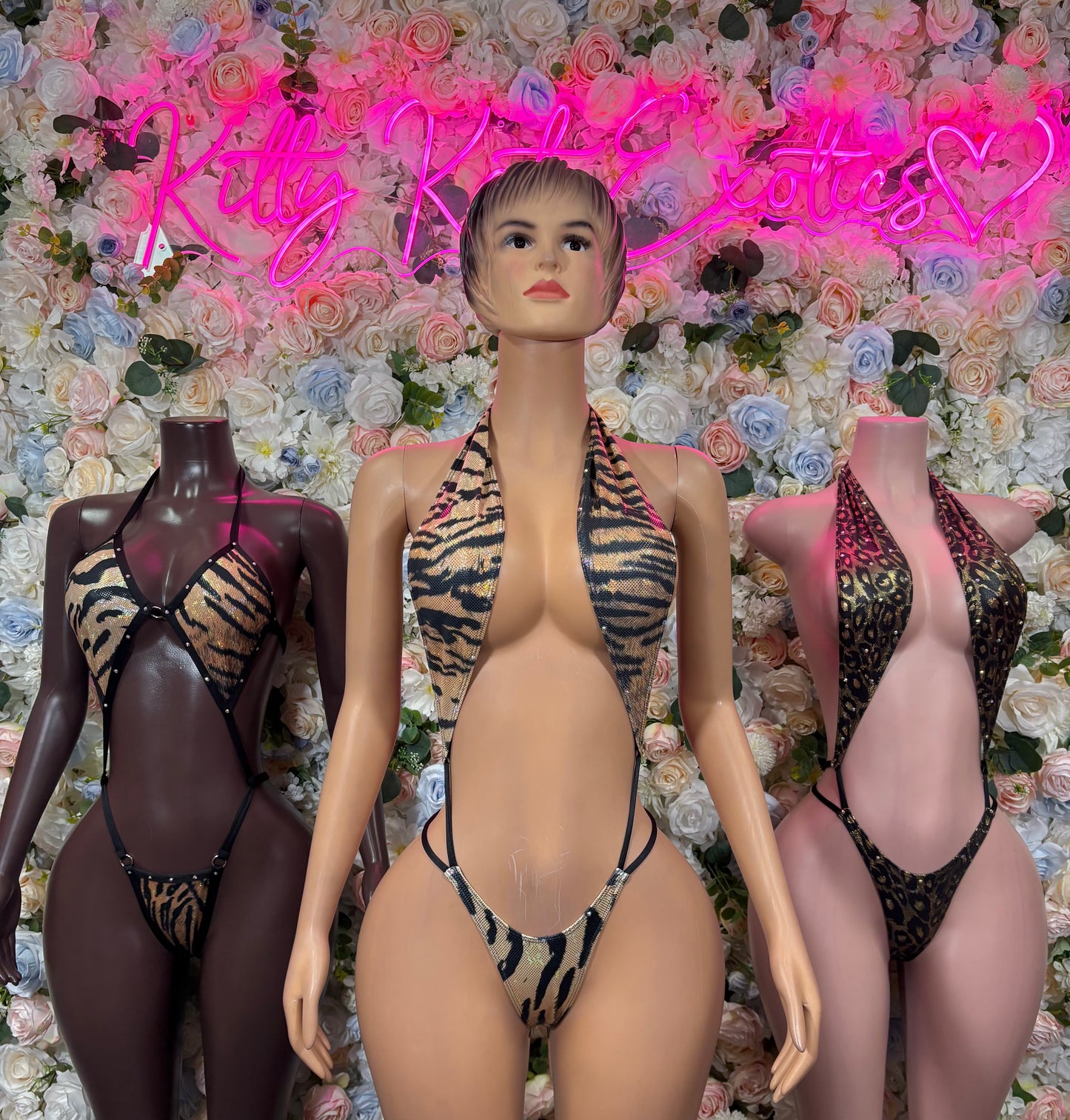 Leopard print halter bodysuit with plunging front and thin side straps, front view