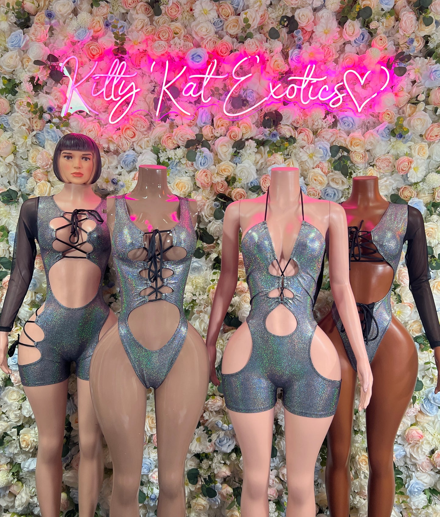 Silver metallic lace-up bodysuit with cutouts and sleeved mesh detail, front view