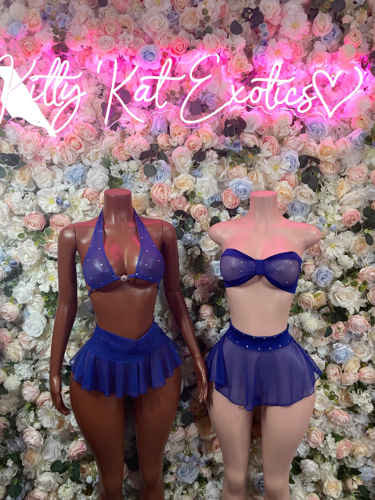 Blue sheer bustier and mini skirt set with bow front, two front views