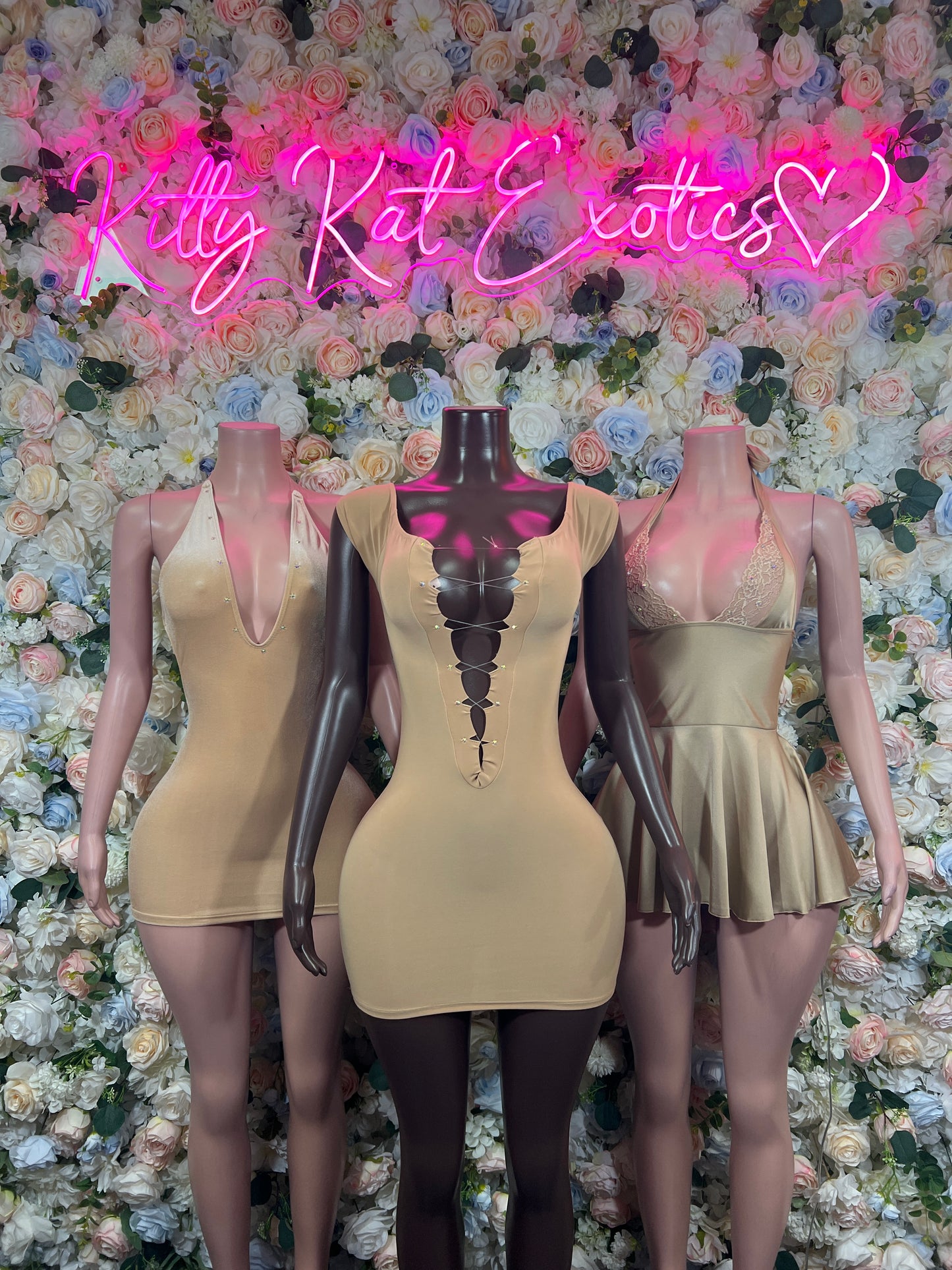 Sleeveless nude mini dress with corset-style lace-up front and scoop neckline