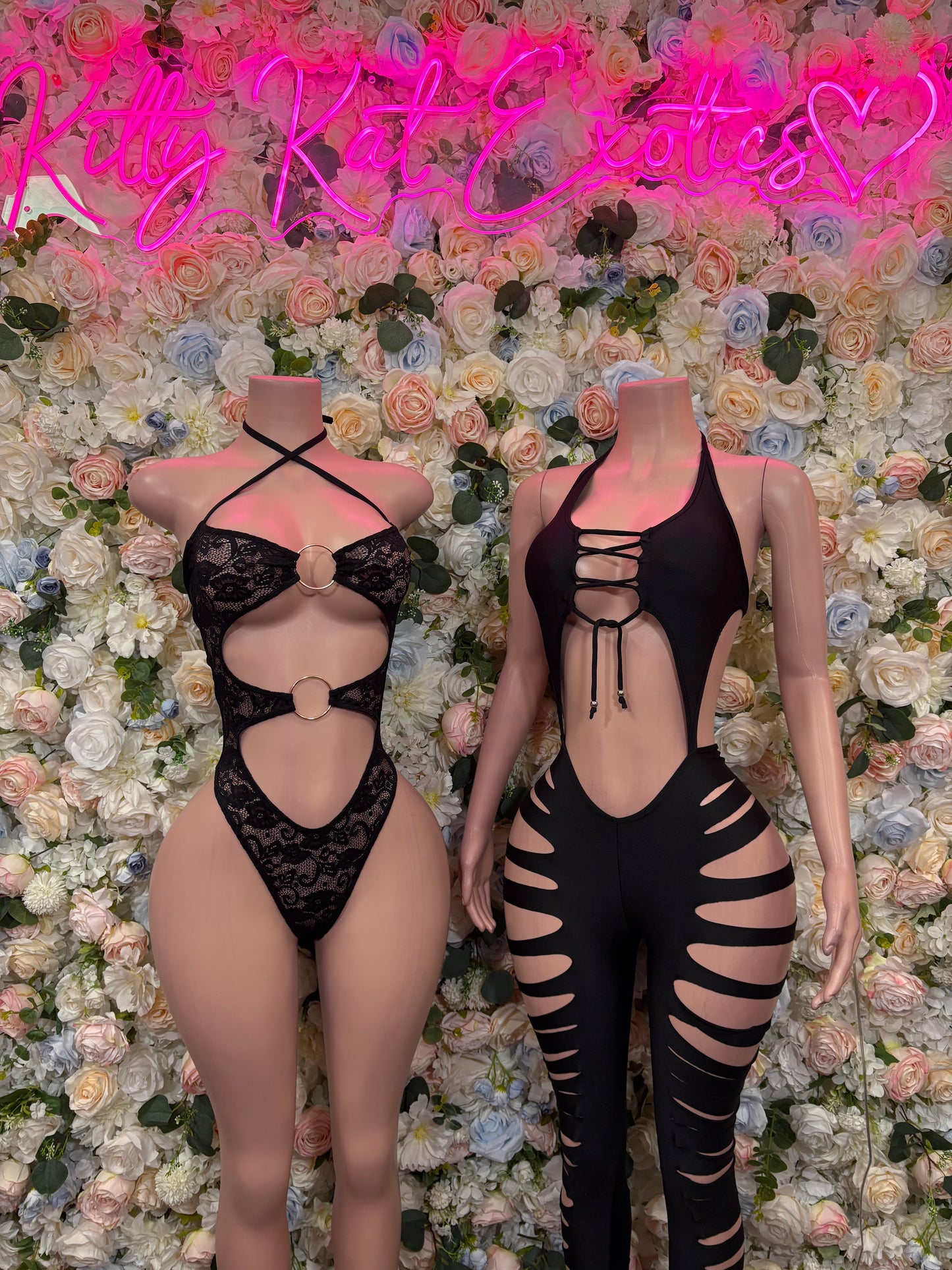 Black lace cutout bodysuit with front crisscross straps and ribbon ties