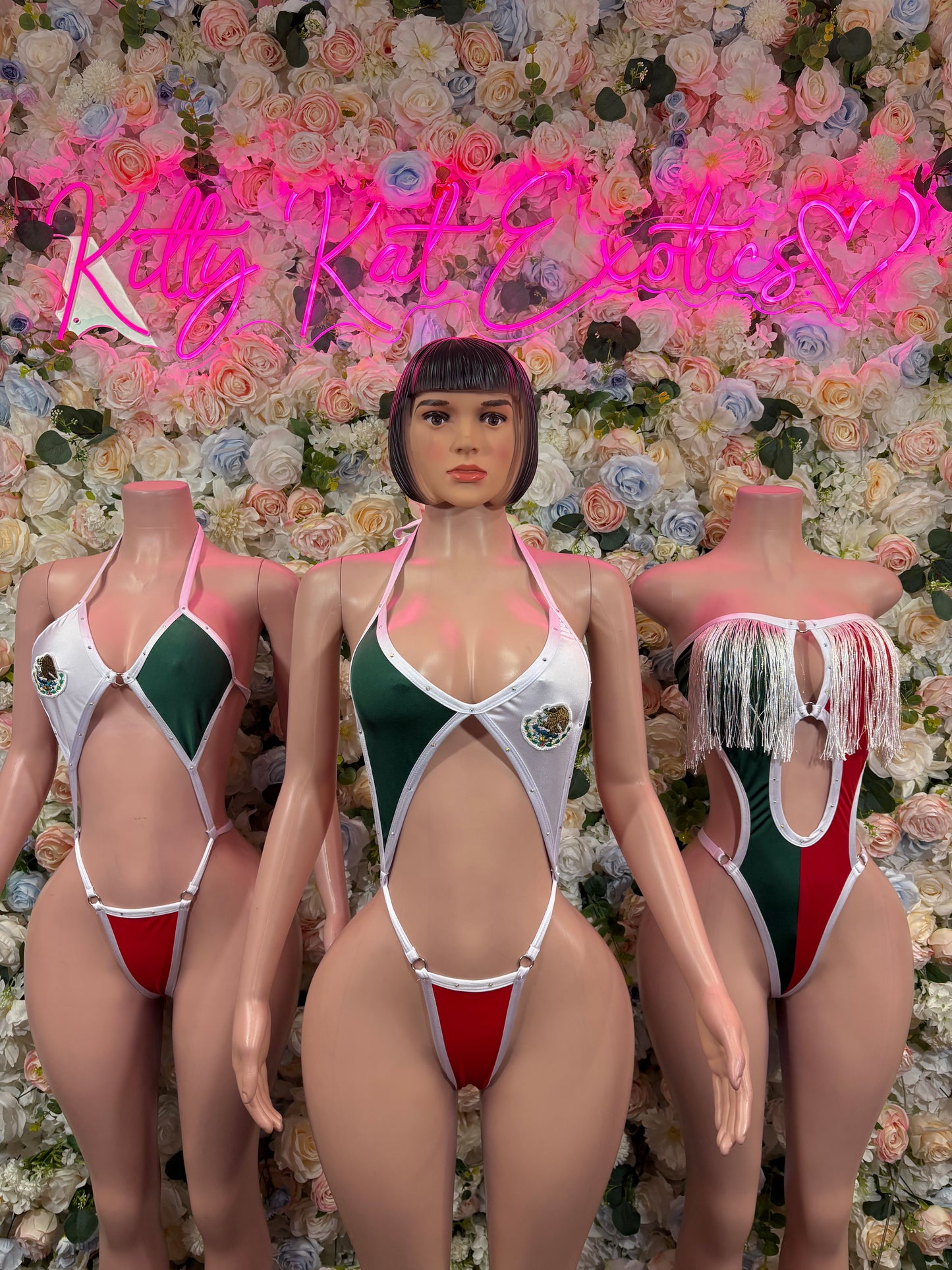 Women’s one-piece swimsuit with red, white, green flag-style design and V-front straps