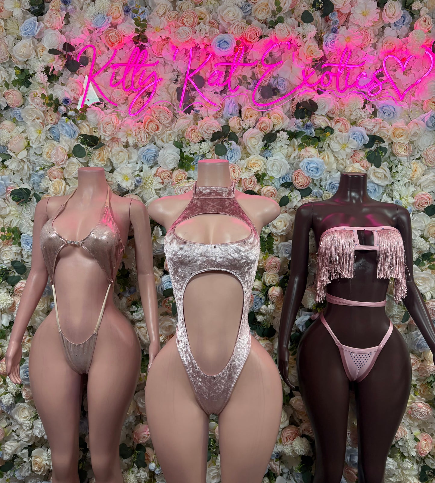 Three one-piece bodysuits: gold, silver, and dark with cutouts and thong bottoms