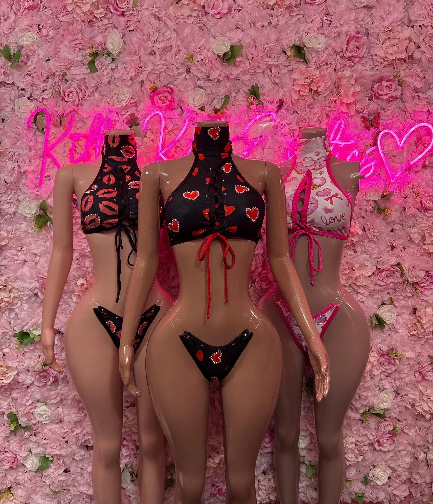Black two-piece dance bodysuit with red heart print, sheer panels and thong bottom
