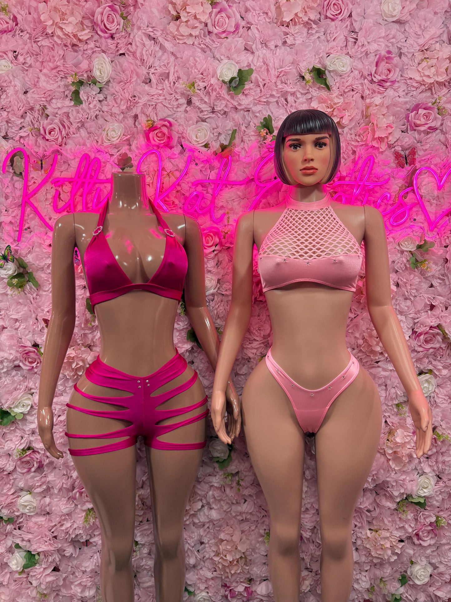 Women’s pink two-piece rave set: fishnet halter top, thong bottom, and strappy cutout shorts