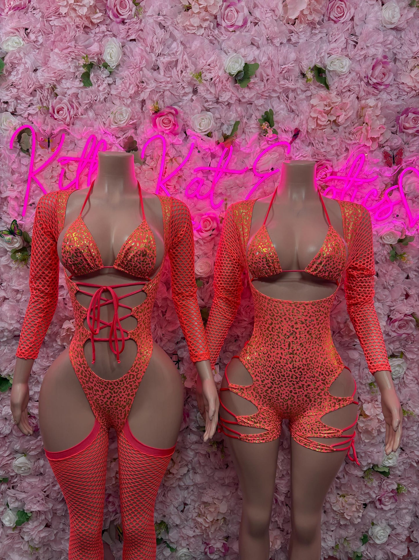 Coral cheetah-print bodysuit with long sleeves and lace-up front and side cutouts