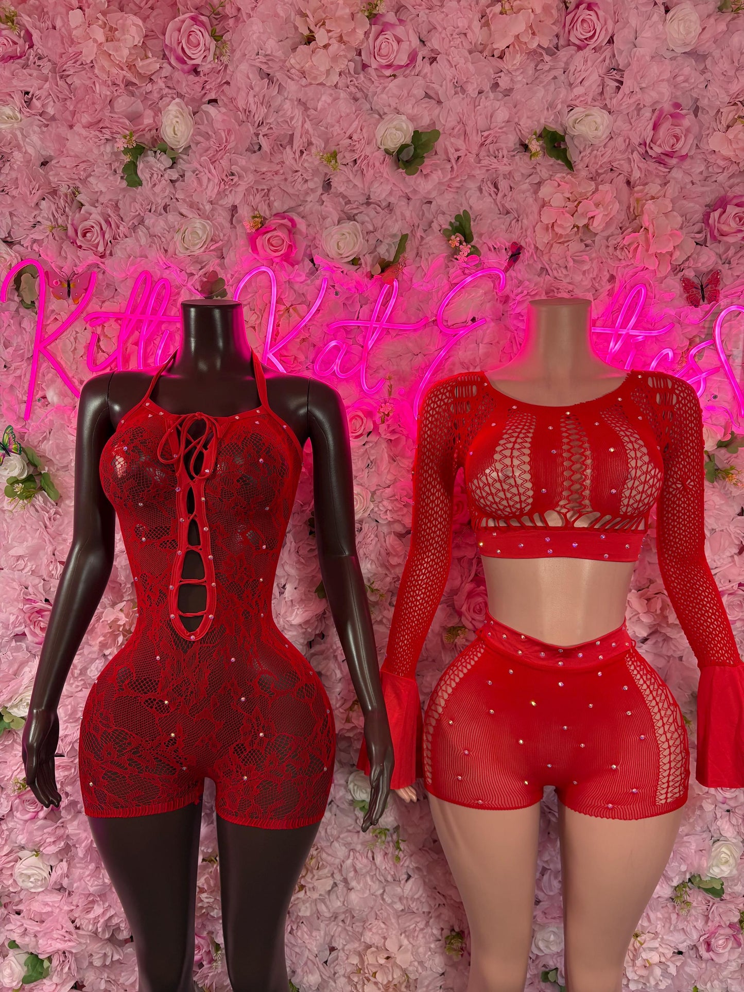 Red fishnet two-piece dancer bodysuit with long-sleeve top and shorts on mannequin