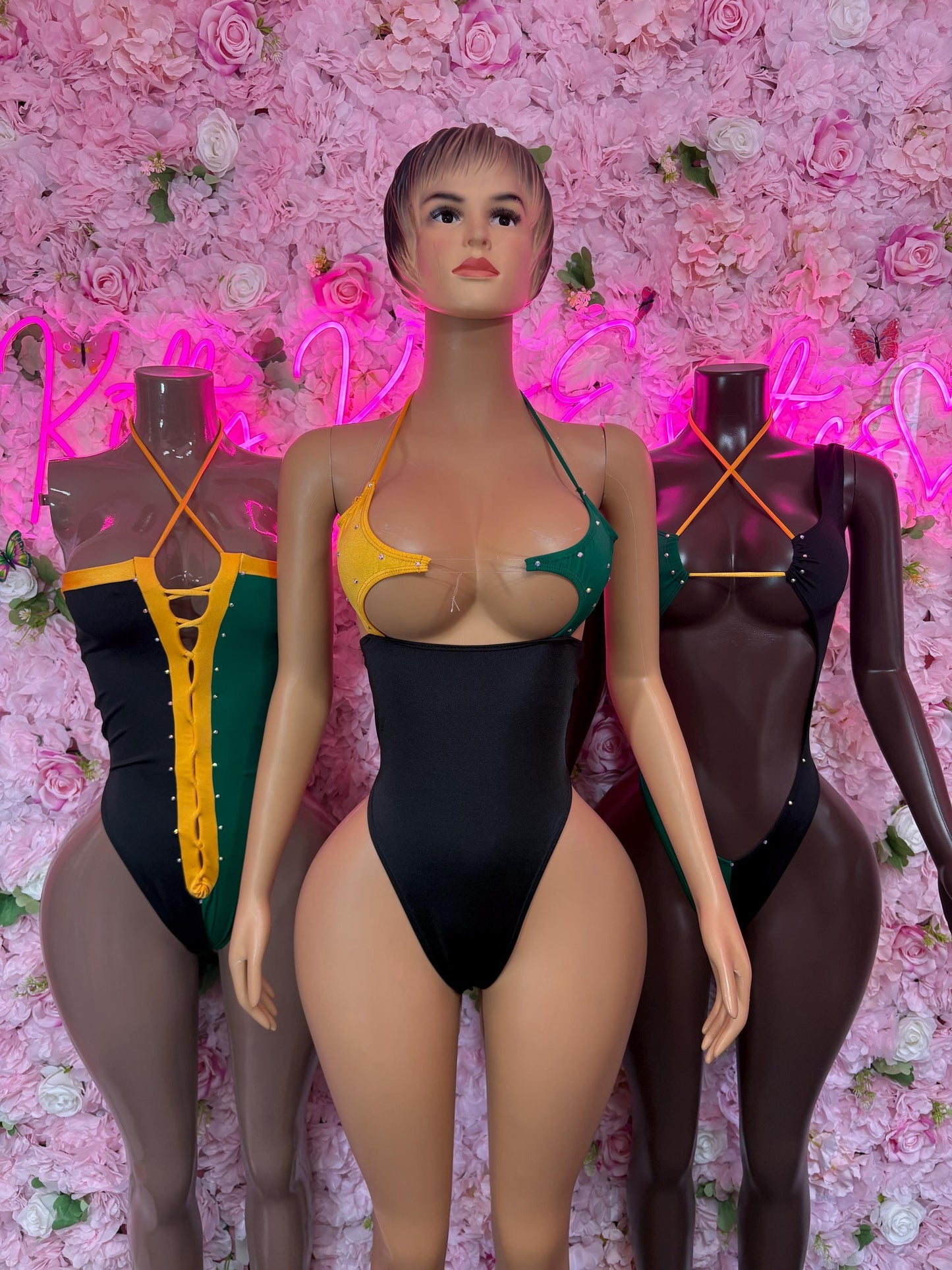 One-piece swimsuit, black front with colorful V-panel straps and high-cut leg