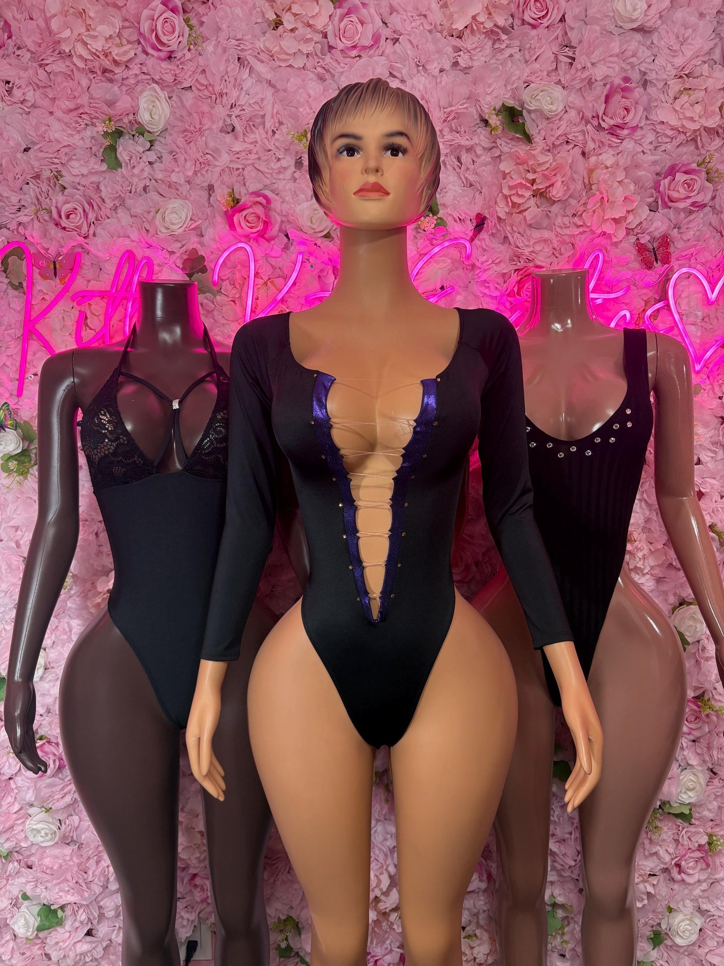 Black long-sleeve bodysuit with deep V front and open collar detail