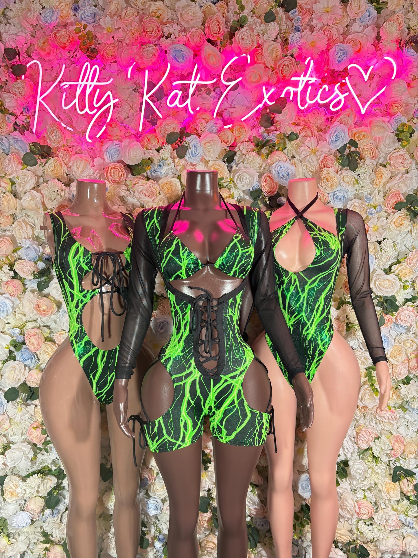 Black one-piece bodysuit set with neon green flame-like print and sheer sleeves