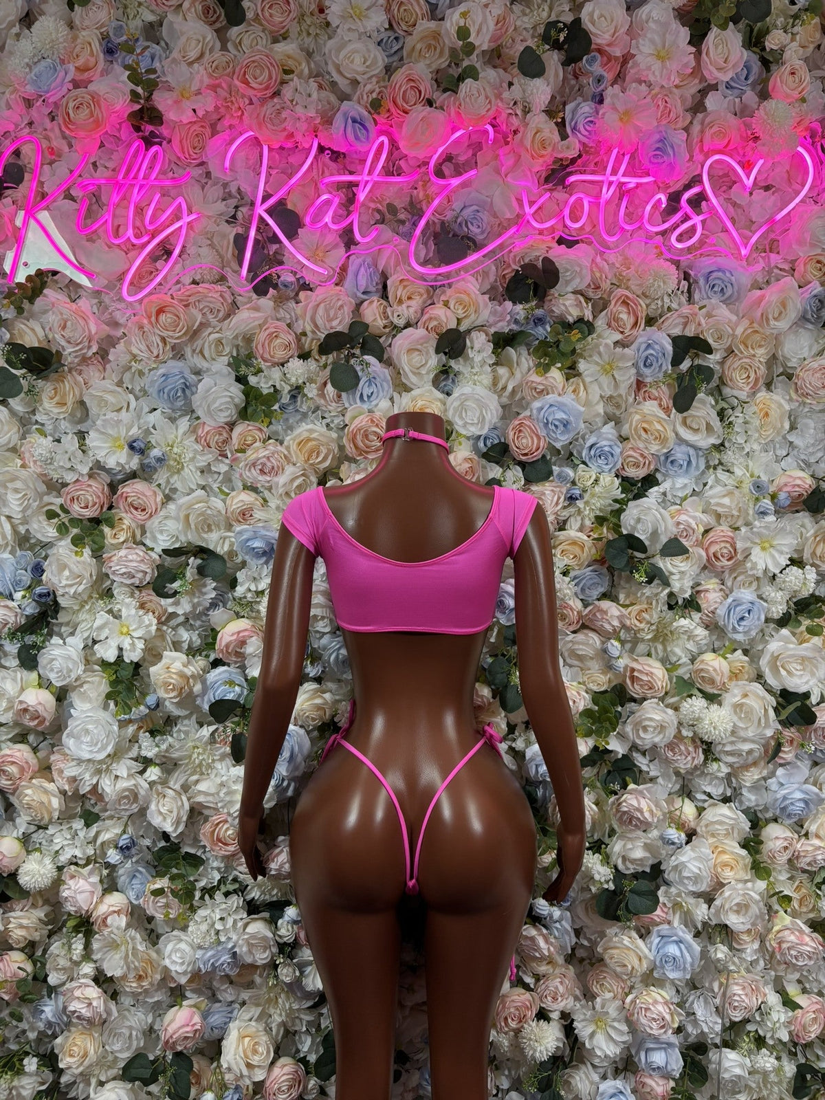 Neon pink halter bikini set with tie-side bottoms and thin neck strap