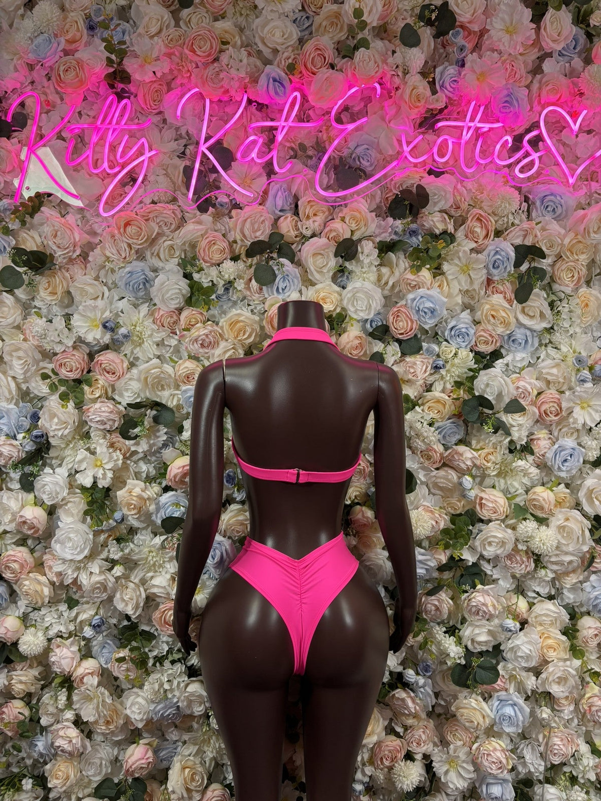 Neon yellow and pink triangle bikini set shown from back with matching bottoms
