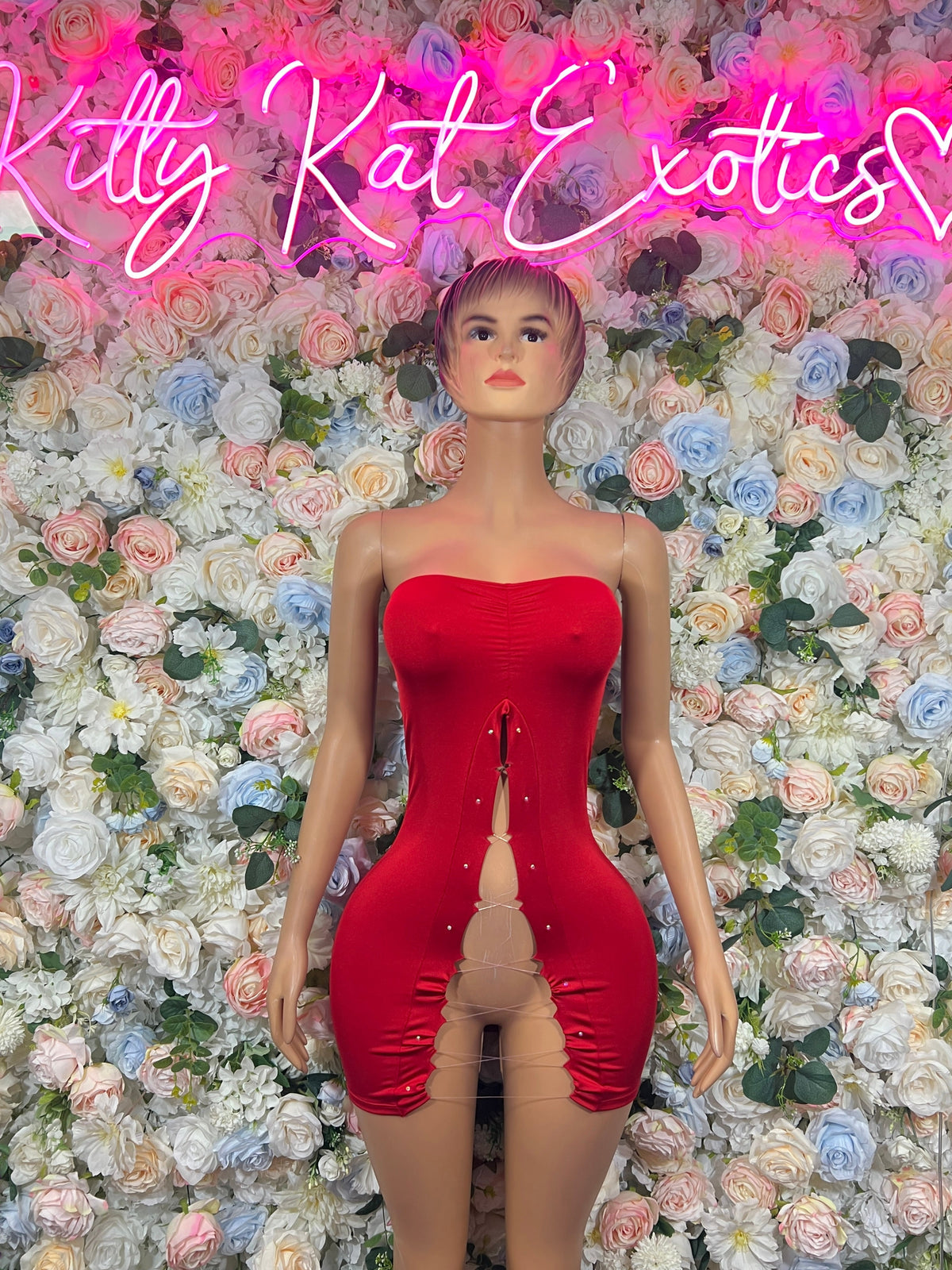 Red strapless cutout one-piece bodysuit, front view with center seam and thong back