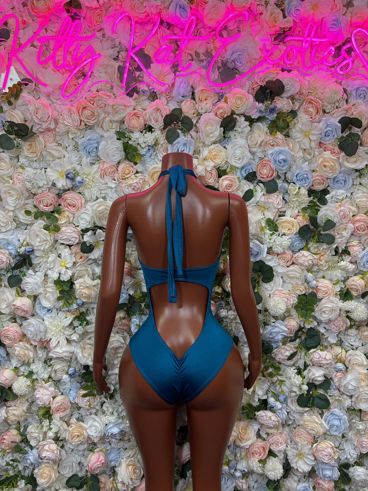 Teal halter one-piece swimsuit back view with crisscross straps and tie