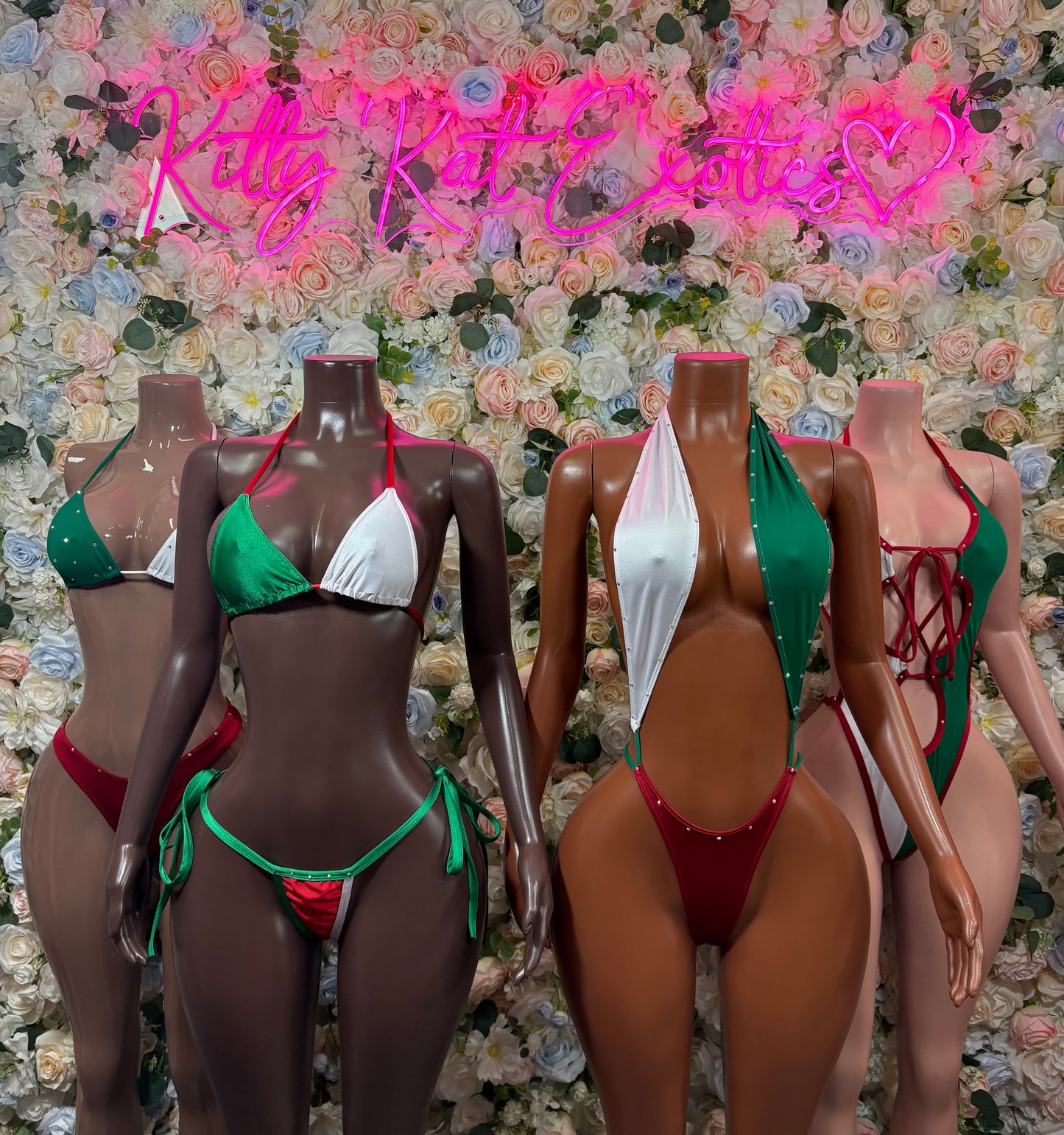Assorted flag bodysuits in green, white, and red with triangle tops and tie sides