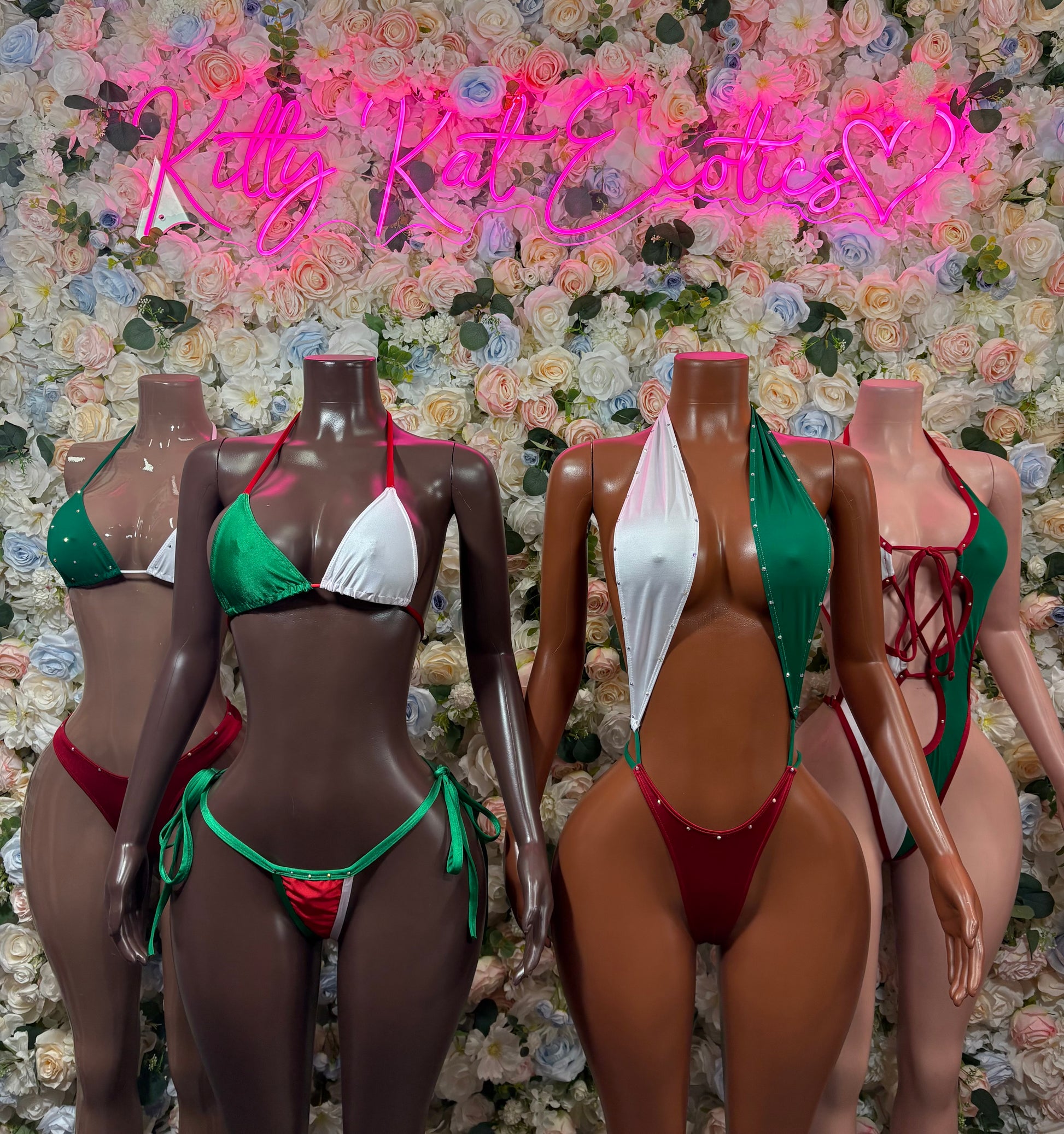 Assorted flag bodysuits in green, white, and red with triangle tops and tie sides