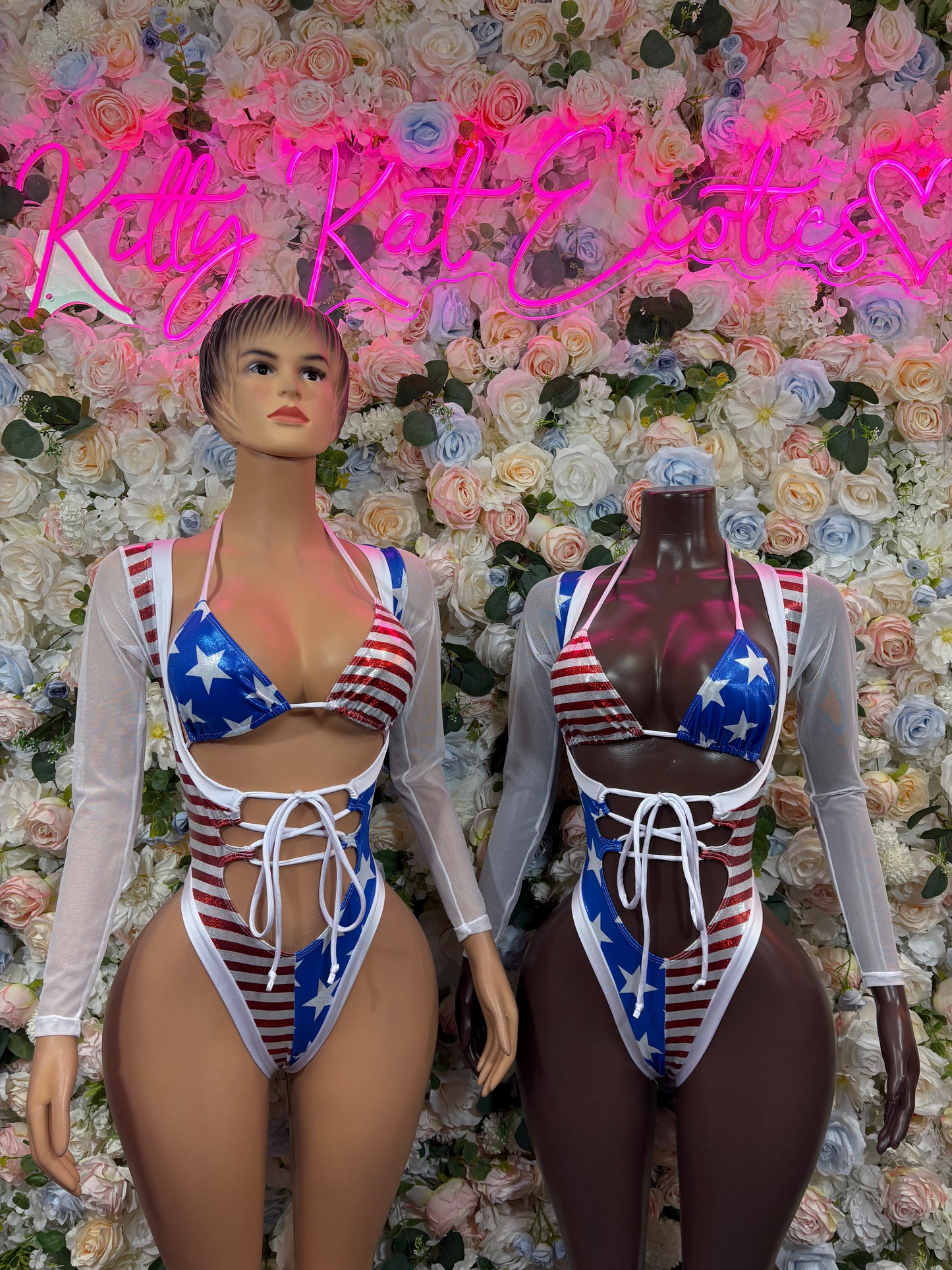 American flag bodysuit with lace-up front, blue star triangles, red striped print, sheer sleeves