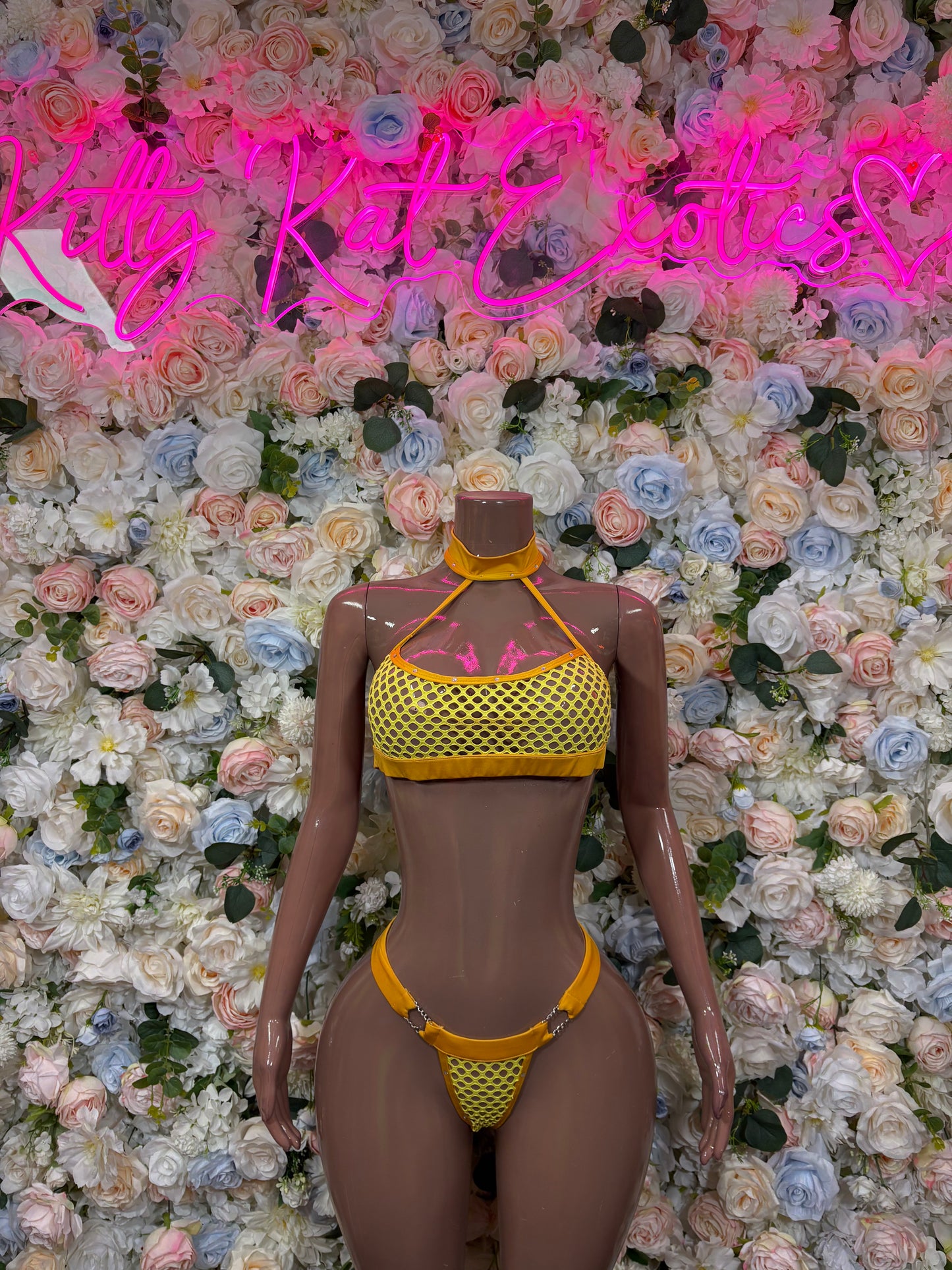 Orange two-piece bikini set with textured triangle top and matching thong bottoms