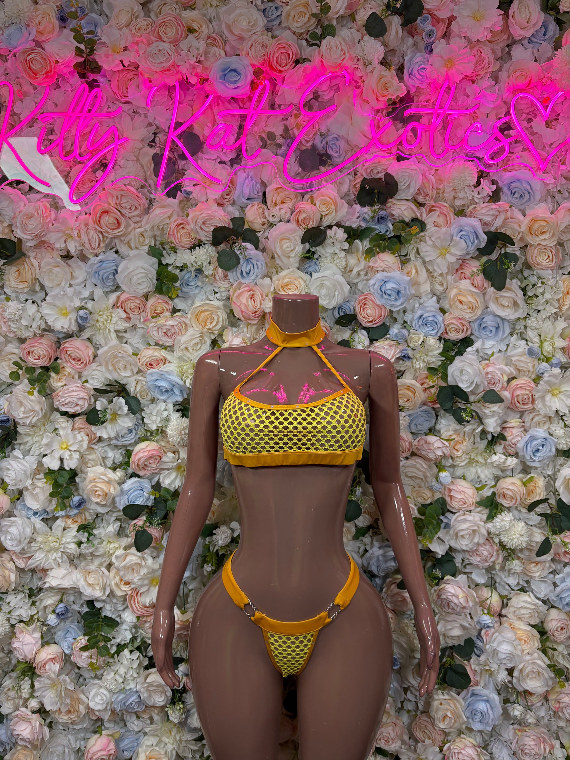 Orange two-piece bikini set with textured triangle top and matching thong bottoms