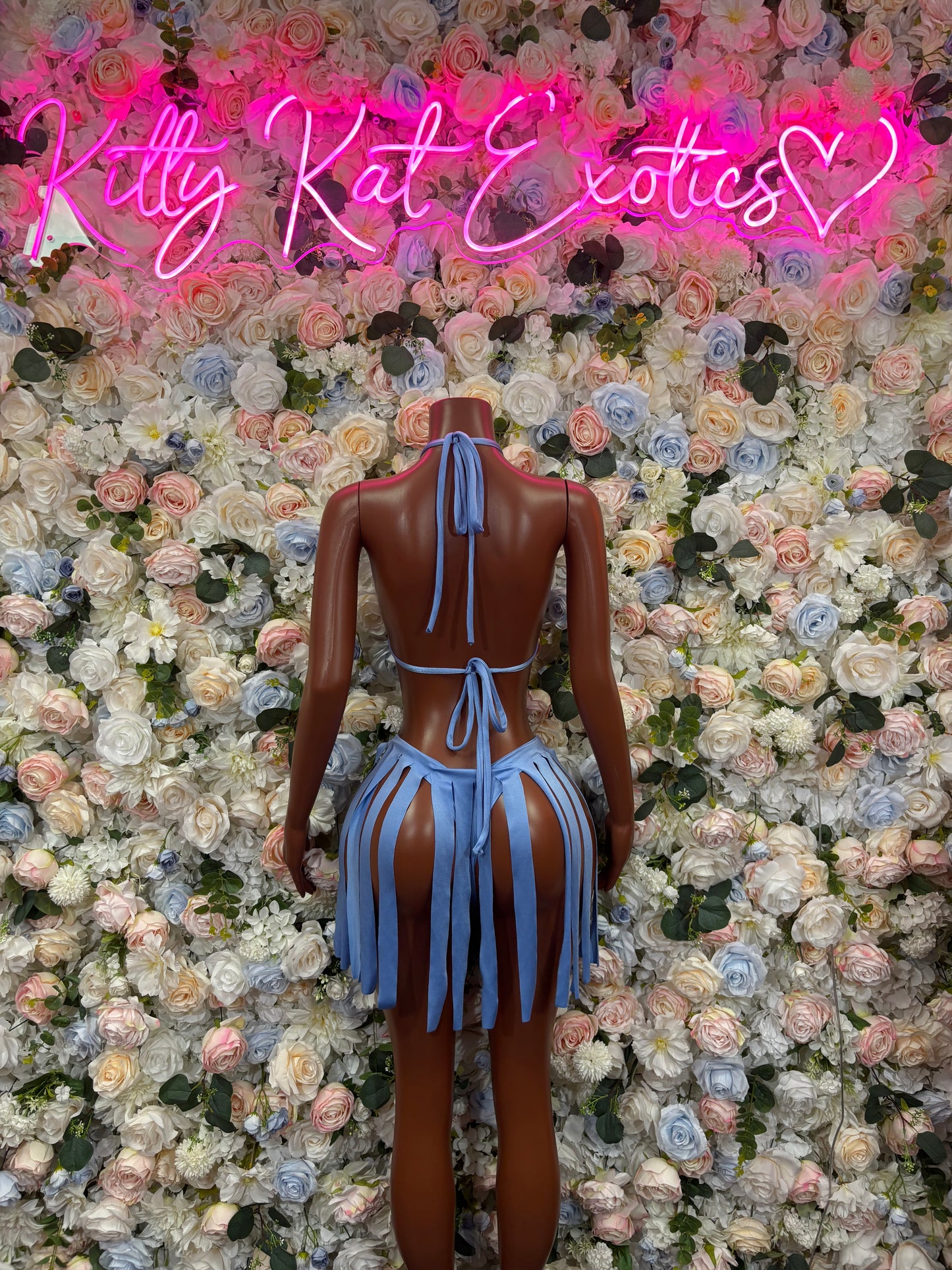 Baby blue two-piece rave outfit from back view with long hanging tassels