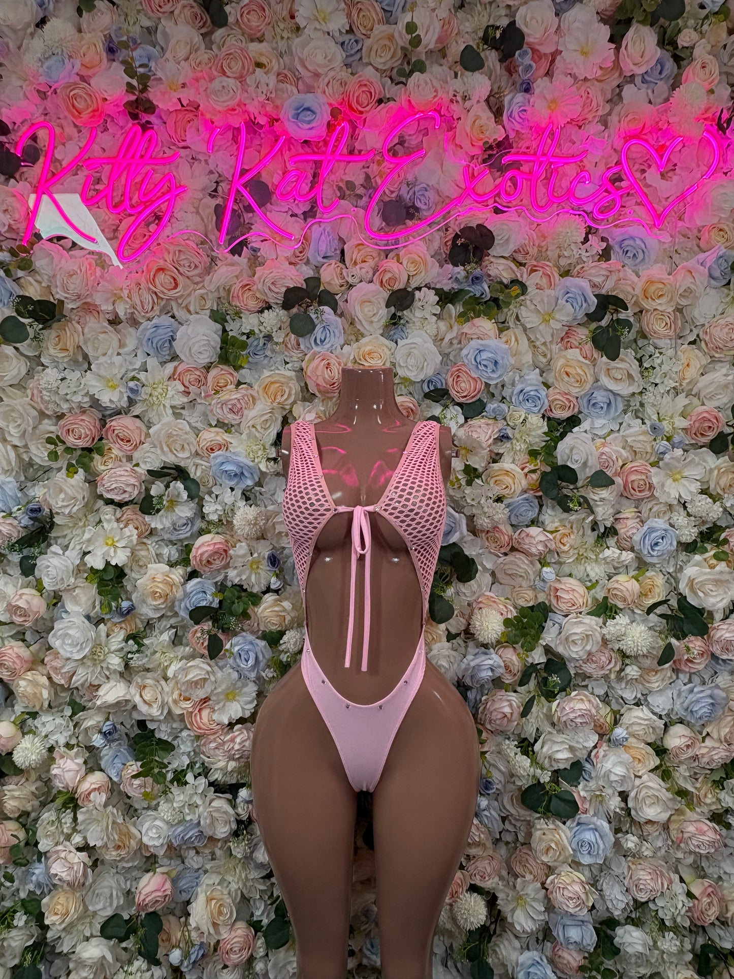 Pink mesh dot bodysuit with high-cut legs and back keyhole