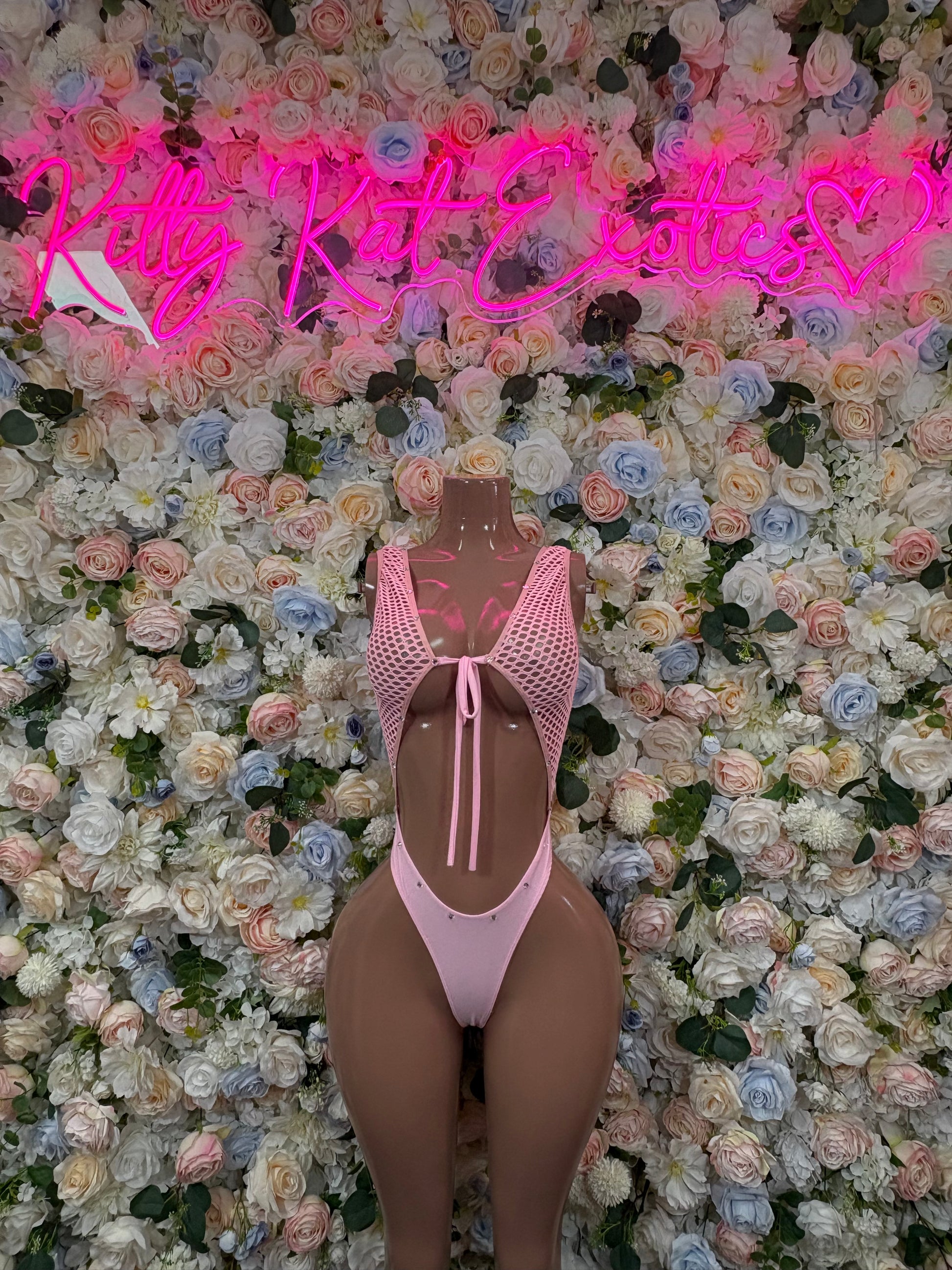 Pink mesh dot bodysuit with high-cut legs and back keyhole