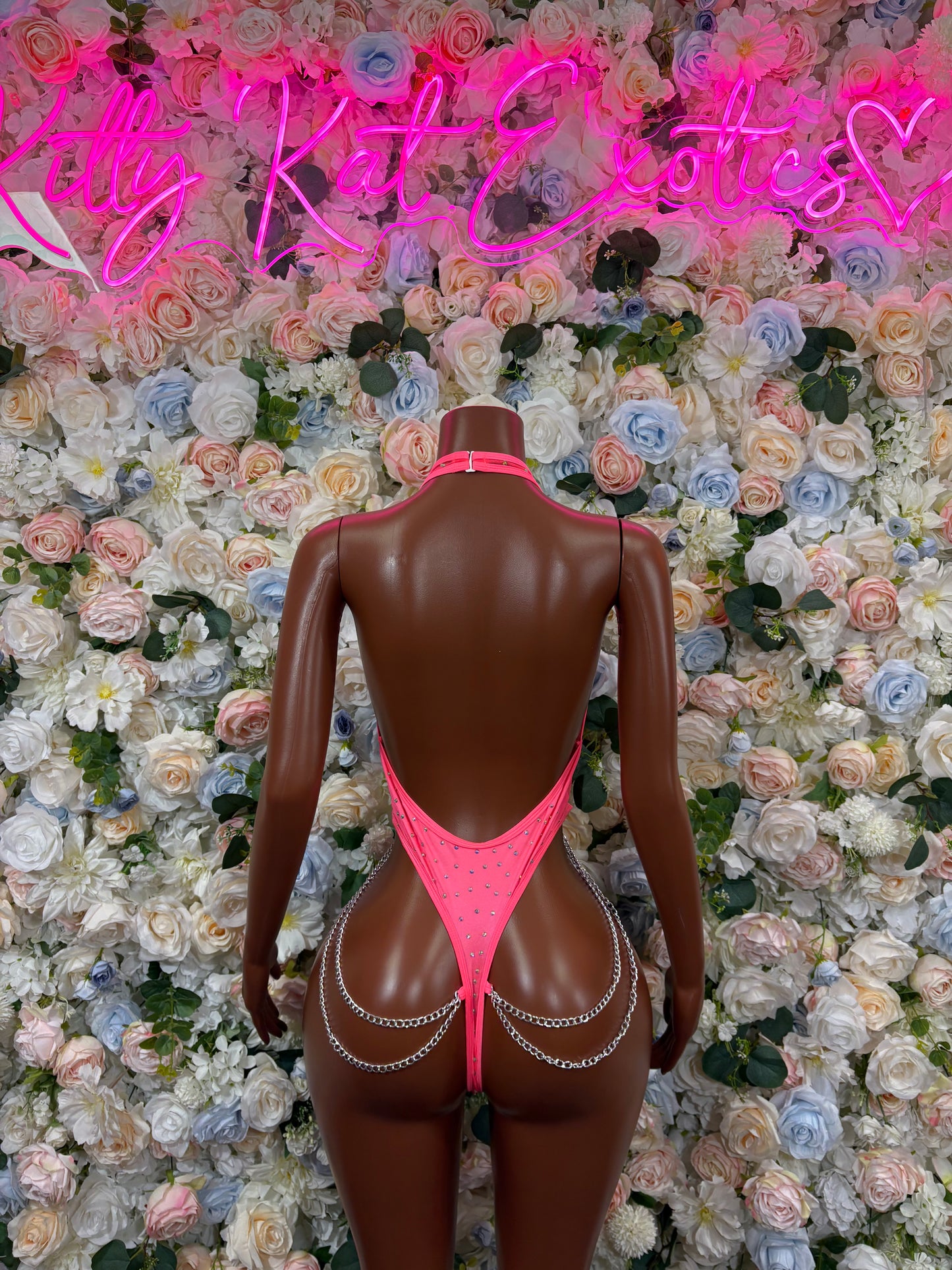 Coral pink rhinestone chain bodysuit back view with low back and drape chain