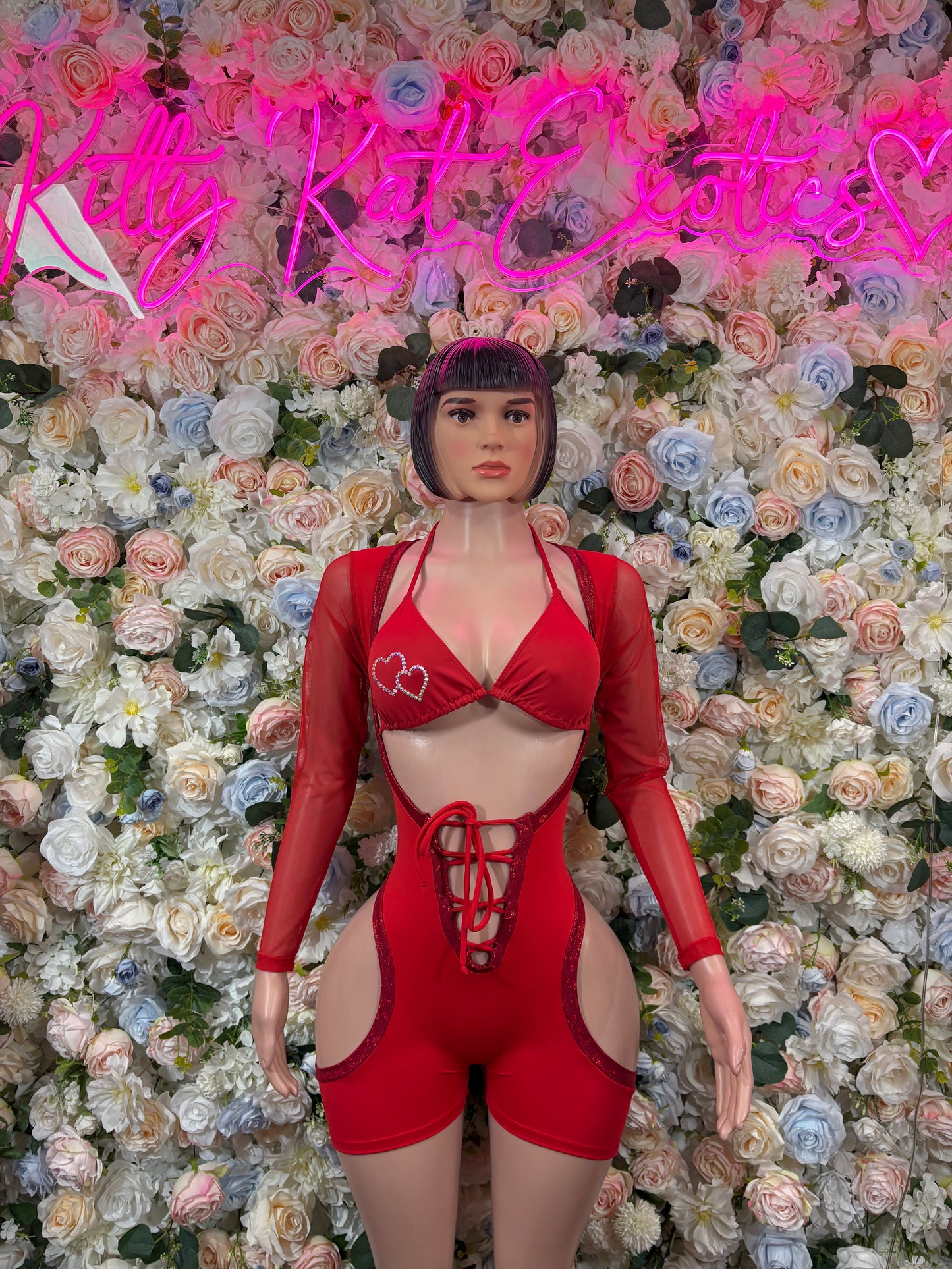 Red heart print lace-up bodysuit with long sleeves and front cutout