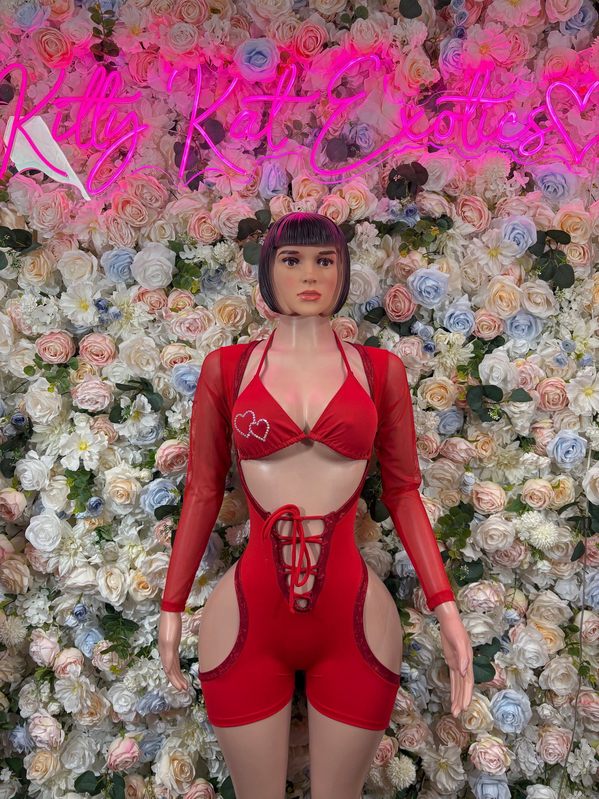 Red heart print lace-up bodysuit with long sleeves and front cutout