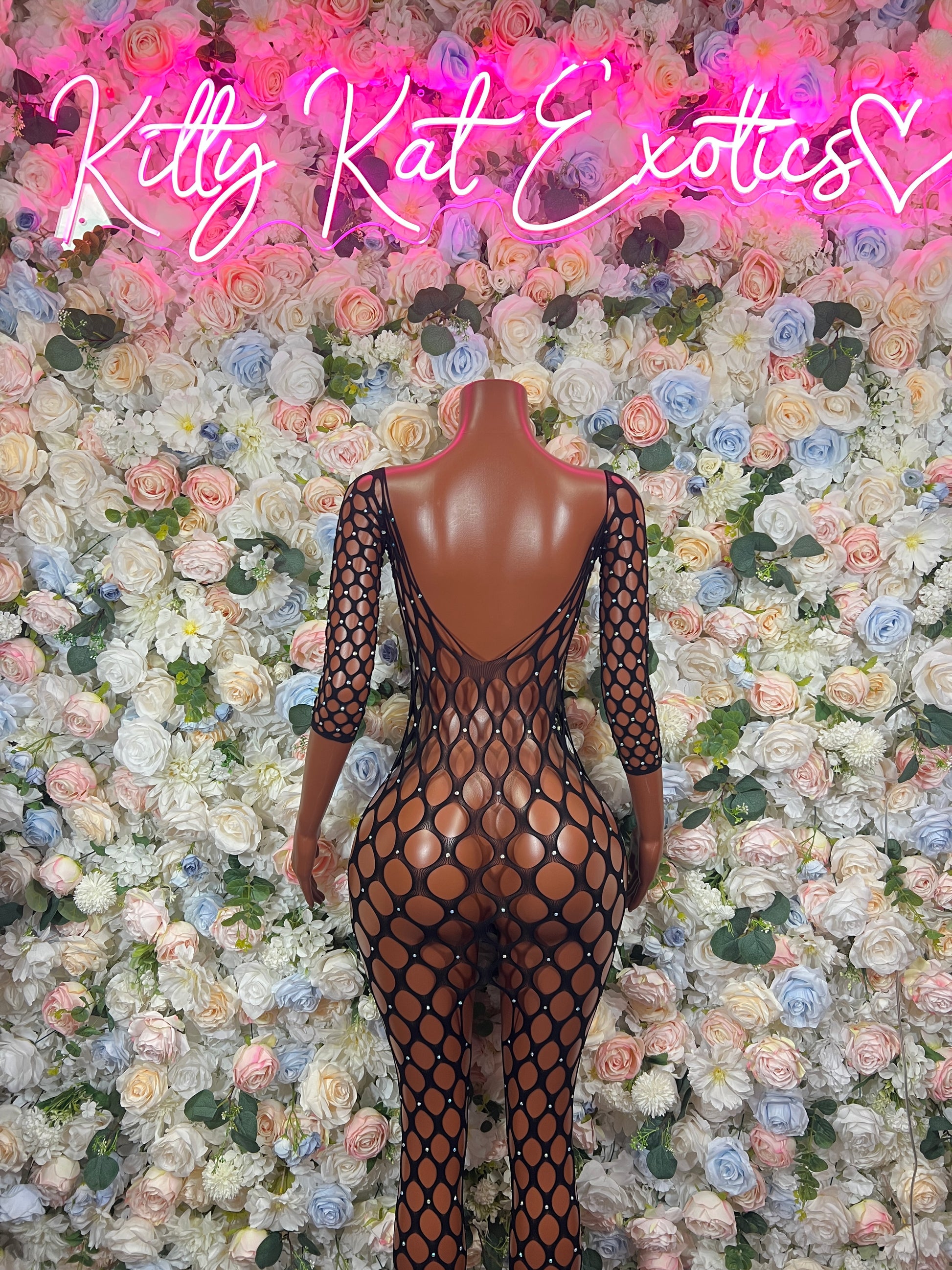 Black fishnet long-sleeve bodysuit with open back cutout