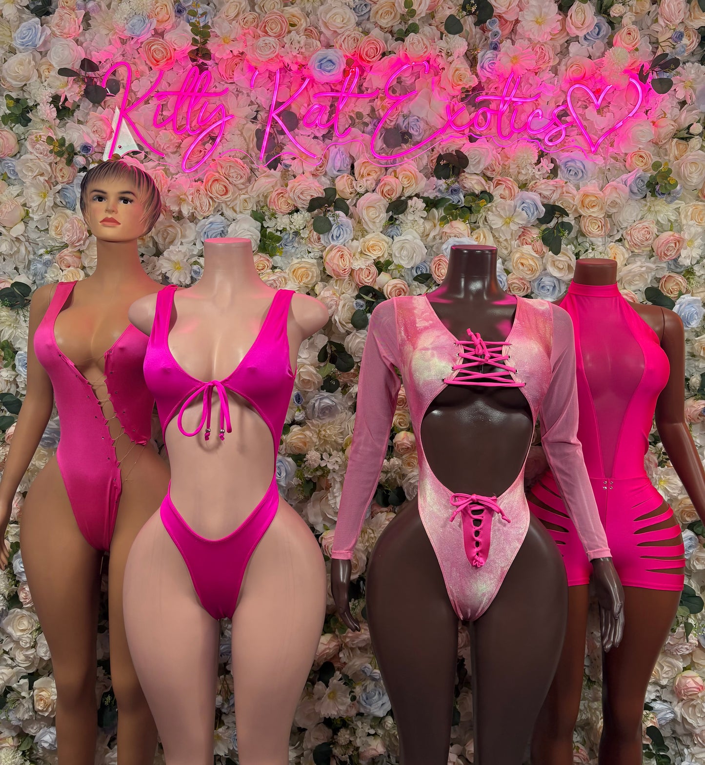 Hot pink tie-front bodysuit with scoop back, shown on mannequins