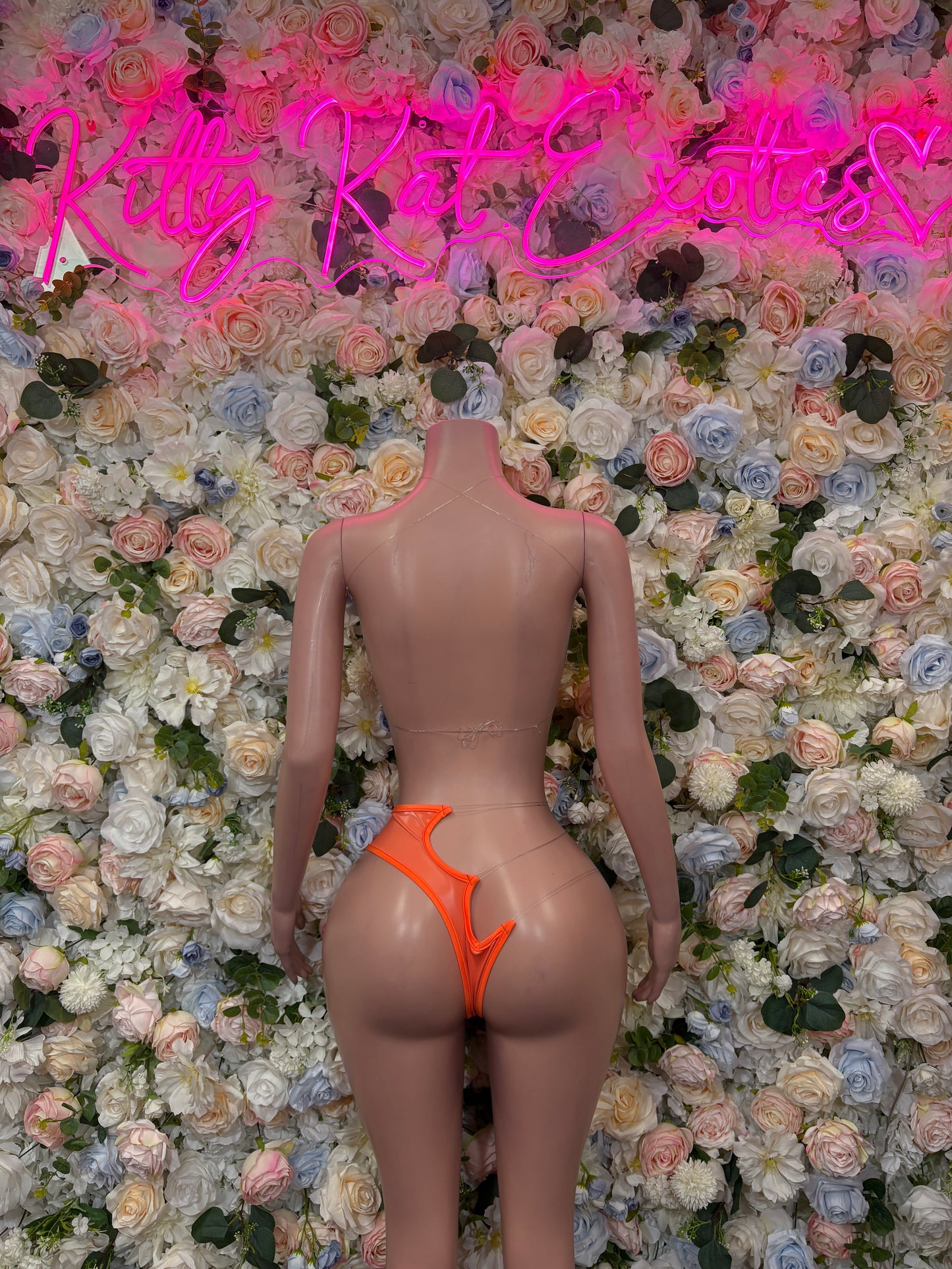 Orange two-piece bikini set, back view with high-cut bottoms and strappy top