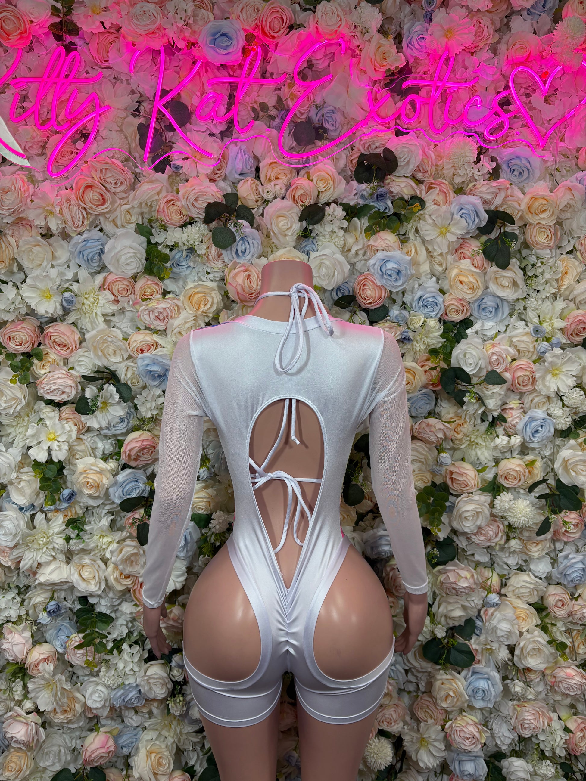 Rainbow holographic dance bodysuit with open back and crisscross lacing, long sleeves