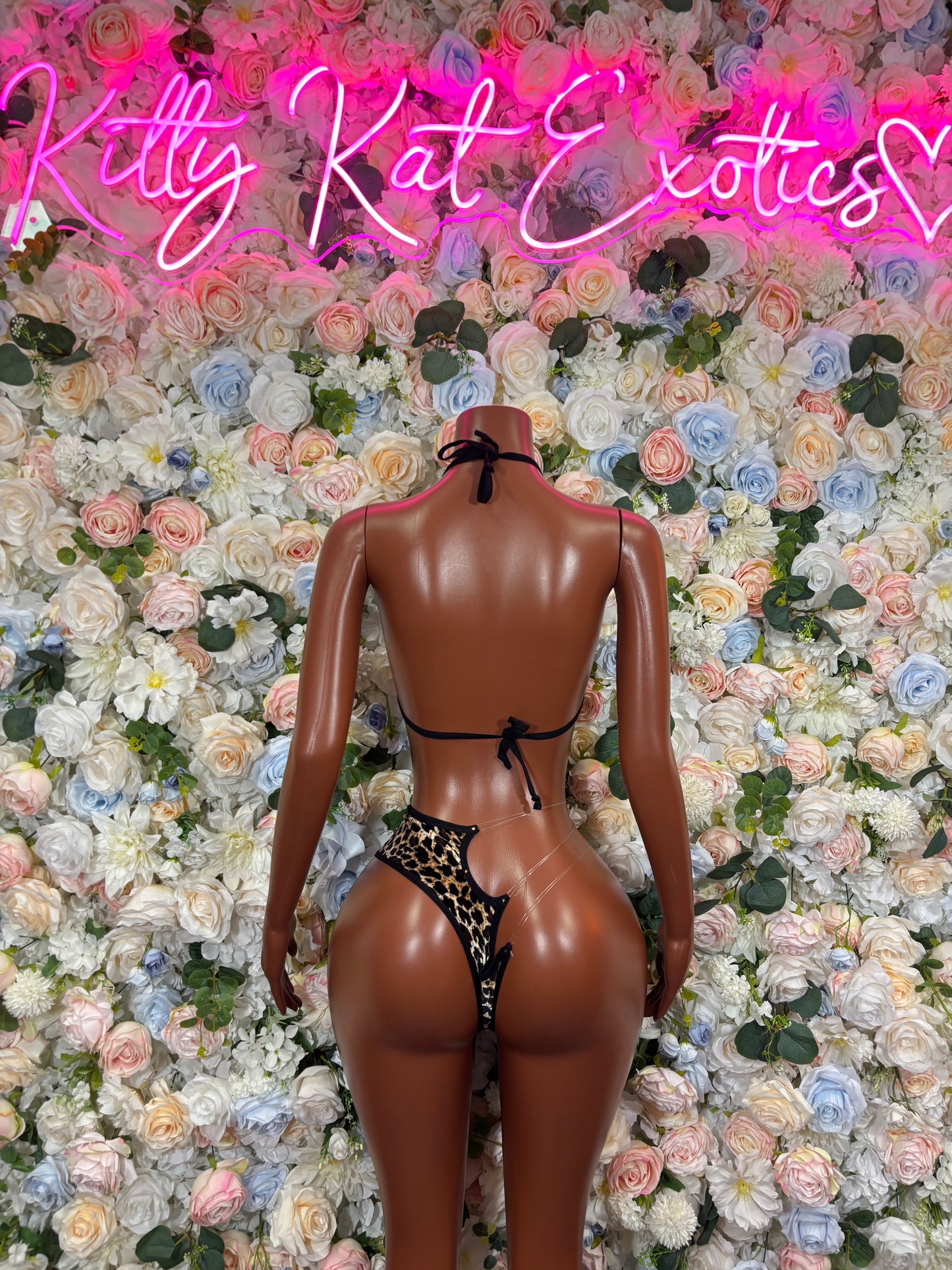 Cheetah-print two-piece rave bikini set, halter bra and thong back view