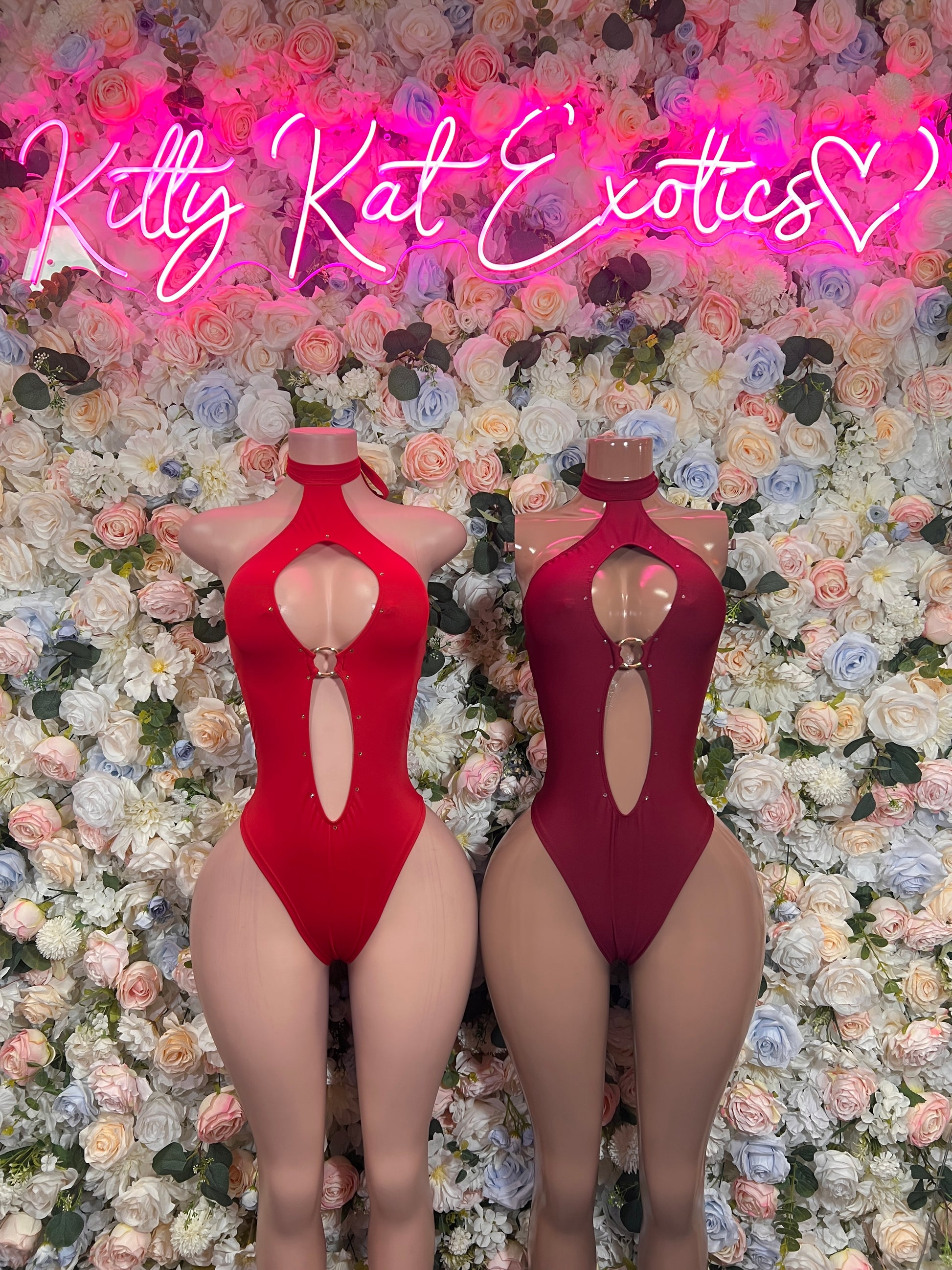 Red and maroon halter bodysuits with open back and oval cutout, cheeky leg