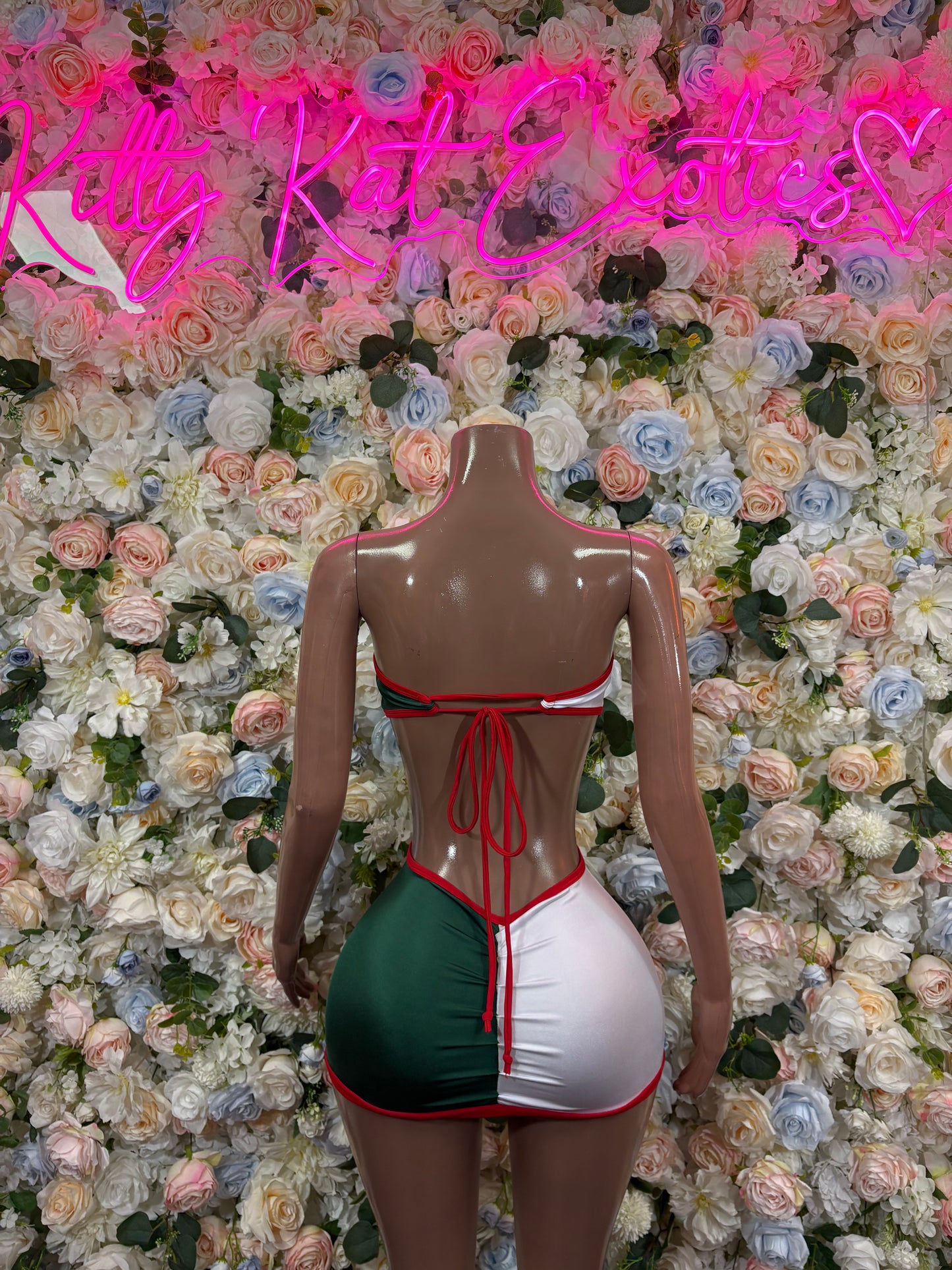 Women's festival dress with green and white cups, red piping, tie at waist