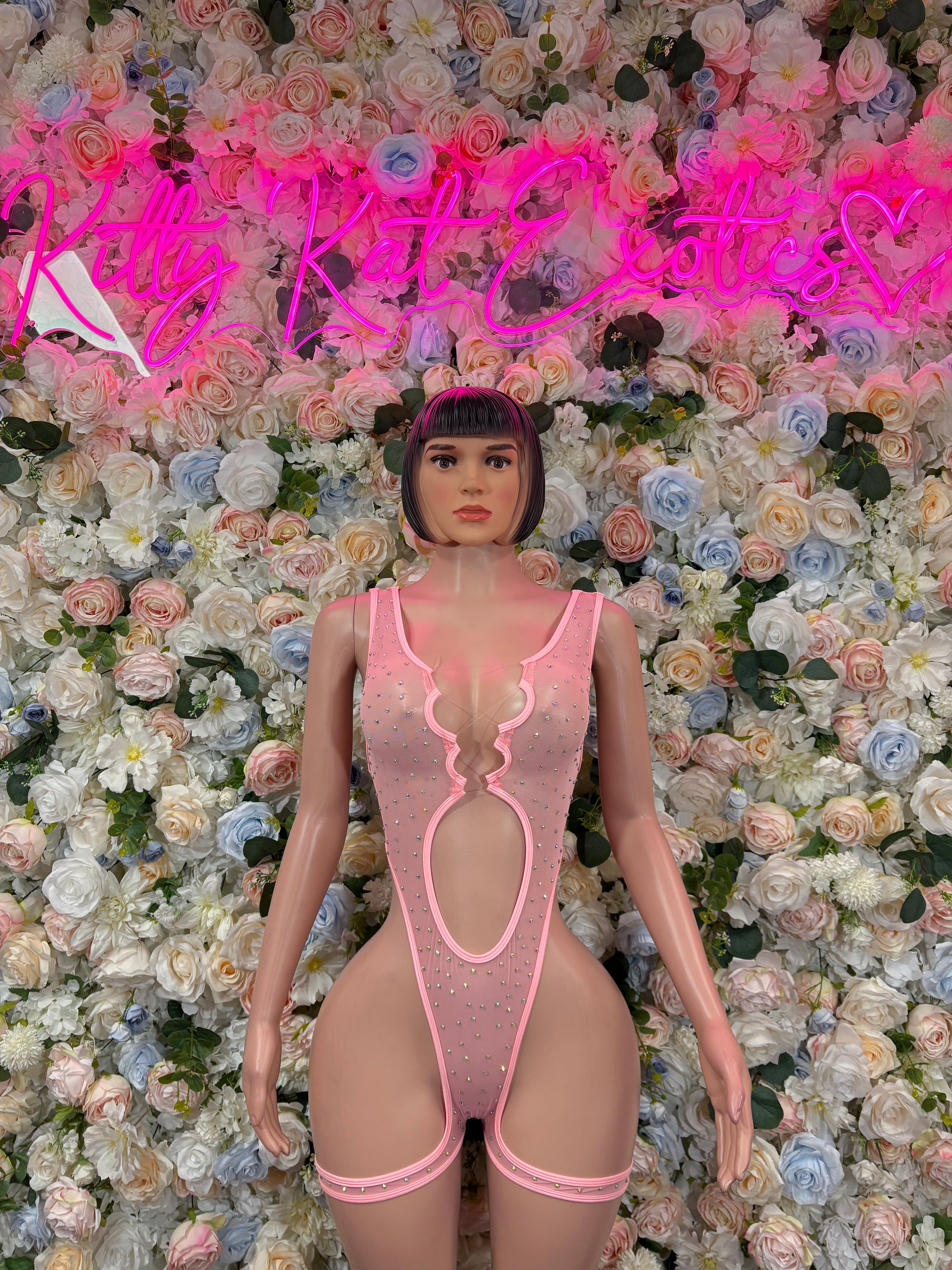 Pink rhinestone bodysuit with scalloped neckline and open back cutout, front view