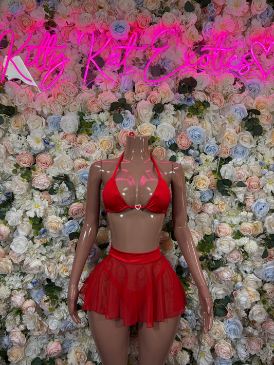 Red bikini top and red ruffled mini skirt set, front view on a mannequin