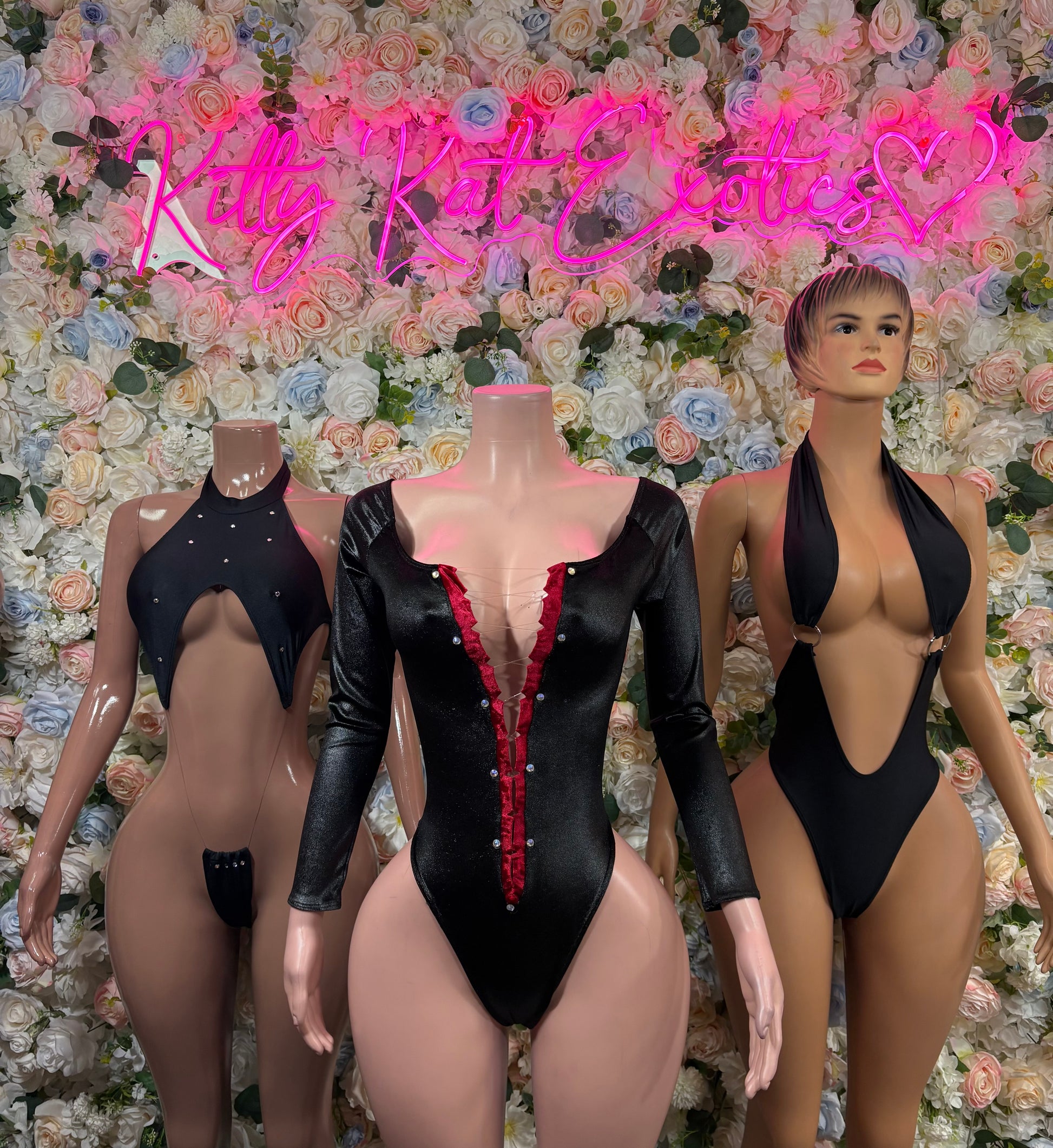 Black one-piece bodysuit with red sequin center trim shown on three models