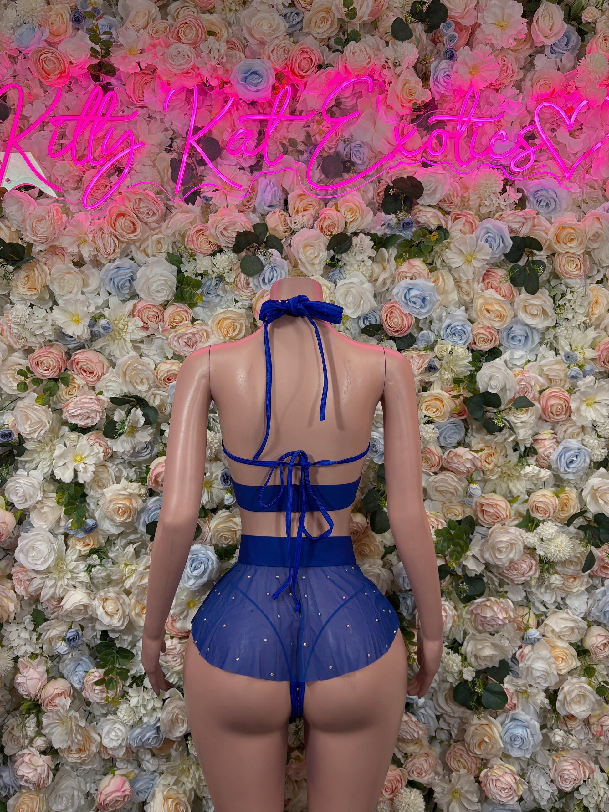 Blue rhinestone halter bra with back crisscross ties and matching mini skirt