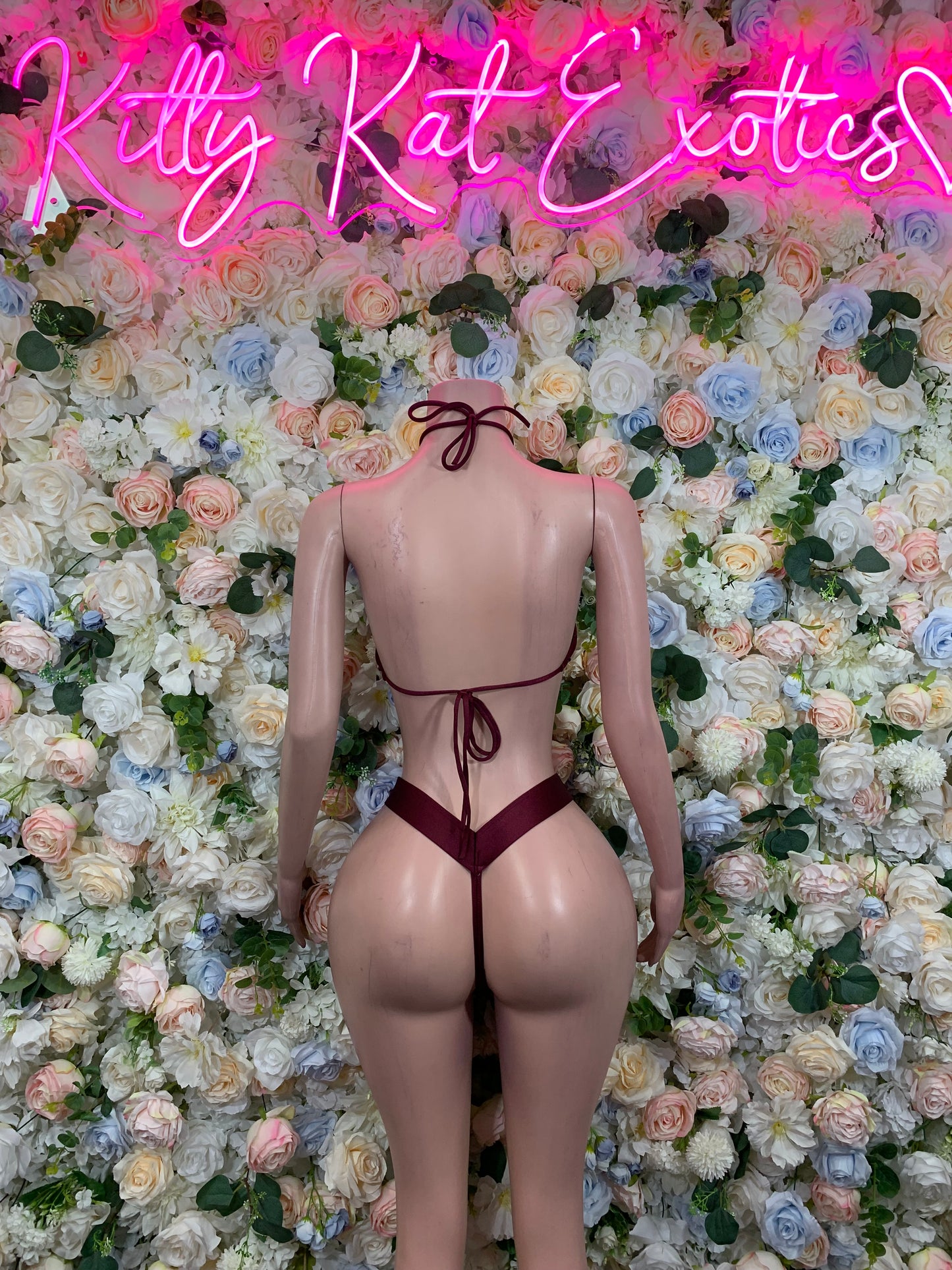 Burgundy two-piece dancewear set, back view with triangle top and thong bottoms