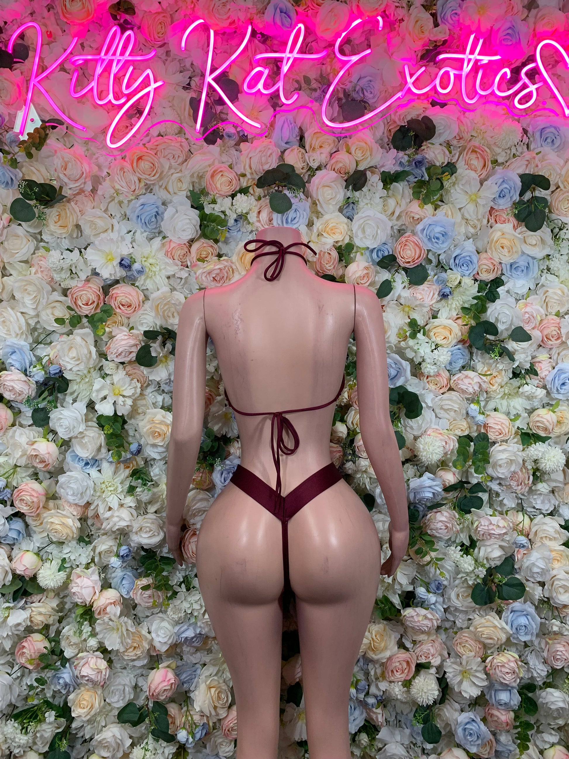 Burgundy two-piece dancewear set, back view with triangle top and thong bottoms