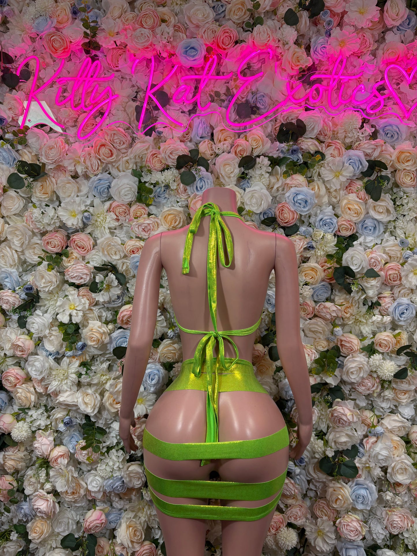 Metallic green bikini set with triangle top and strappy tie-back bottoms