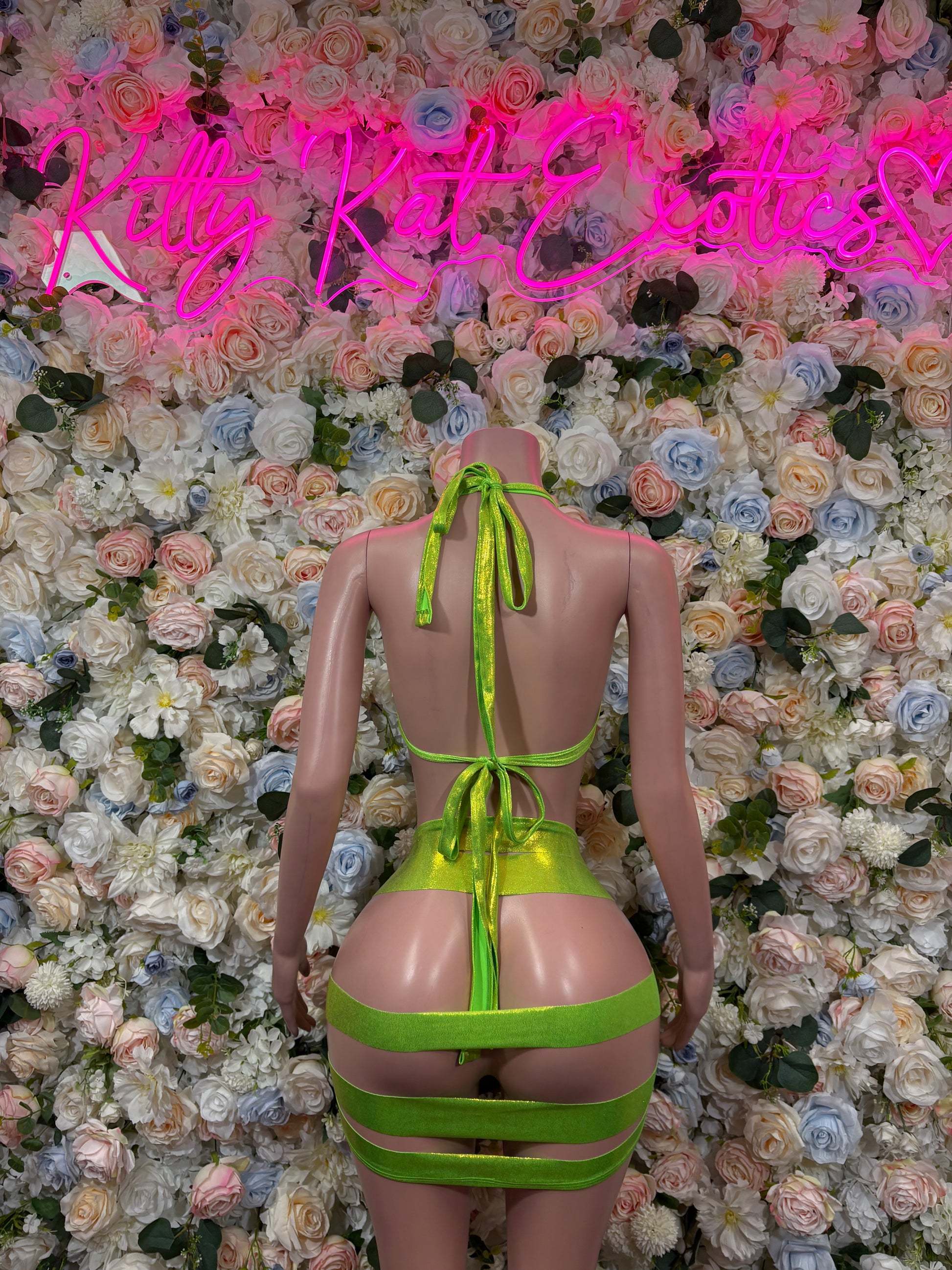 Metallic green bikini set with triangle top and strappy tie-back bottoms