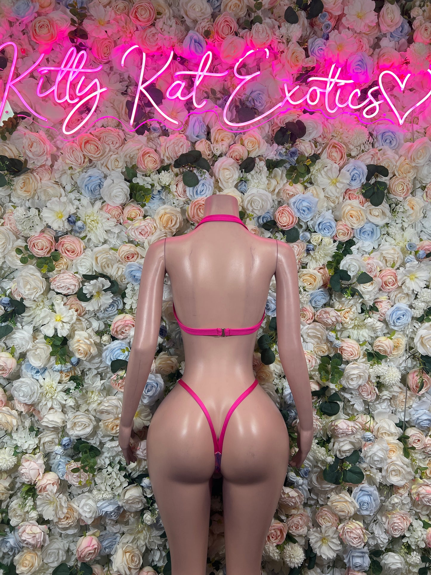 Back view: iridescent pink-purple holographic two-piece bikini set with thin straps